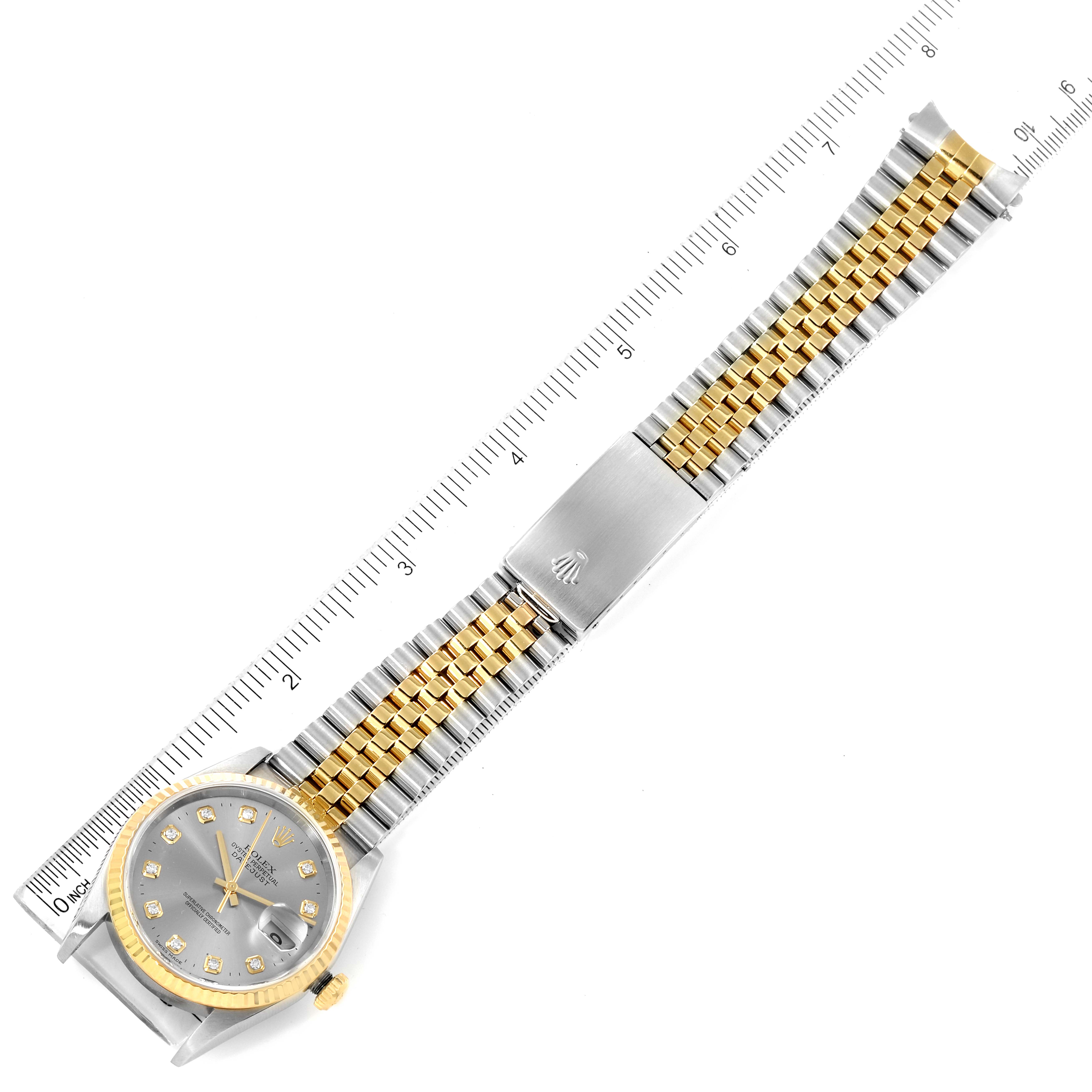 The image shows a top-down view of a Rolex Datejust 16233 Men's Steel and Gold (two tone) Grey Dial 16233 Men's Steel and Gold (two tone) Grey Dial watch, displaying its face, bracelet, and clasp, measured with a ruler.