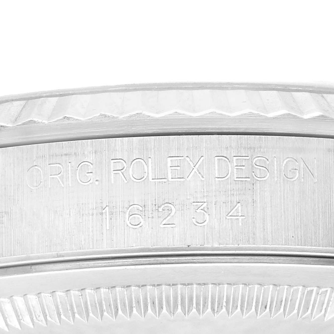 This close-up image shows the side of the case of a Rolex Datejust 16234 Men's Stainless Steel Black Dial 16234 Men's Stainless Steel Black Dial watch, highlighting the engraved model and brand name.
