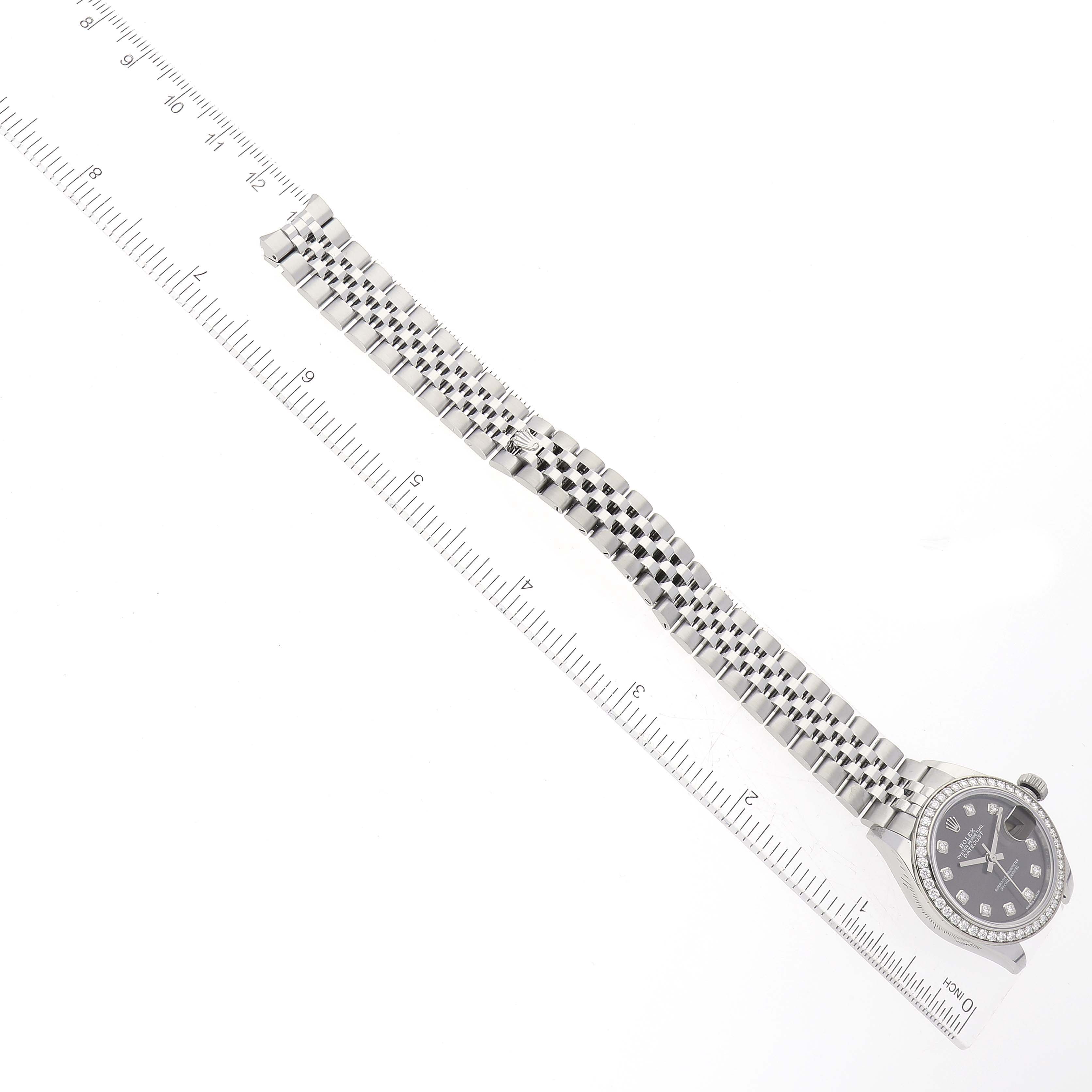 The image shows a Rolex Datejust 279384 Women's Stainless Steel Grey Dial 279384 Women's Stainless Steel Grey Dial model watch laid flat with a focus on its face and bracelet alongside a measuring ruler.