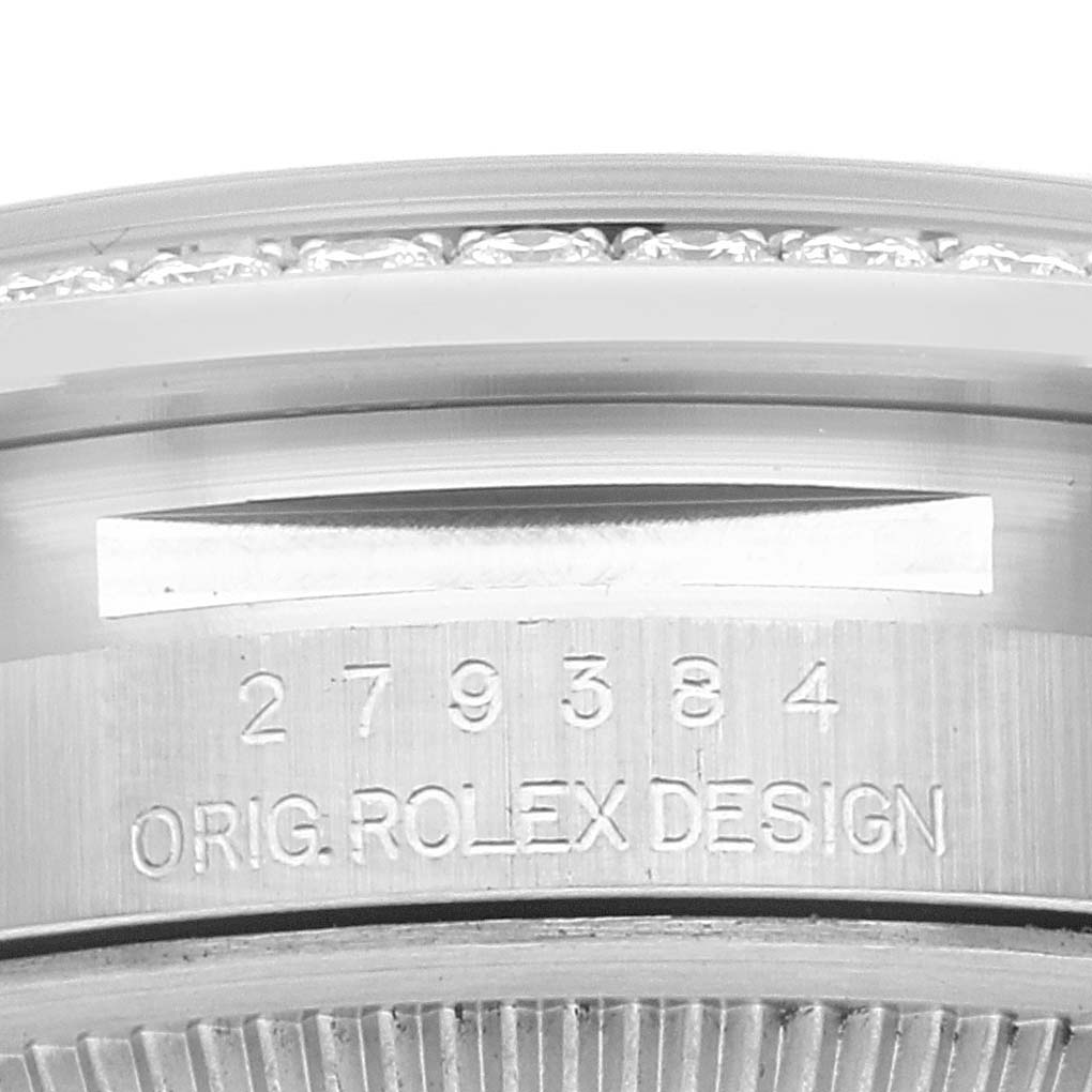 The image shows a close-up of the serial number and "ORIG. ROLEX DESIGN" engraving on the side of the Rolex Datejust 279384 Women's Stainless Steel Grey Dial 279384 Women's Stainless Steel Grey Dial watch case.