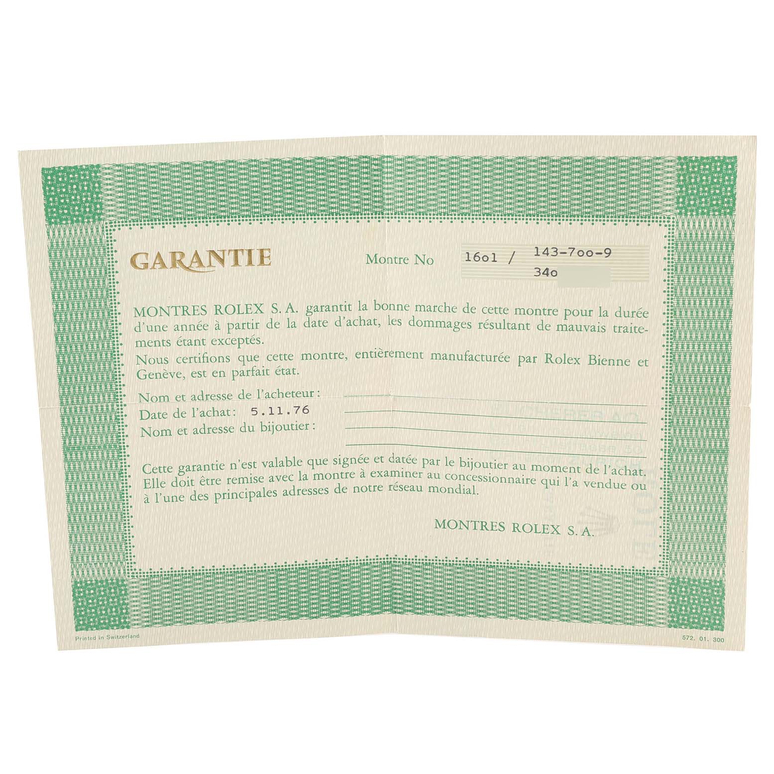 This is an angled view of the warranty card for a Vintage Collection model by Rolex.