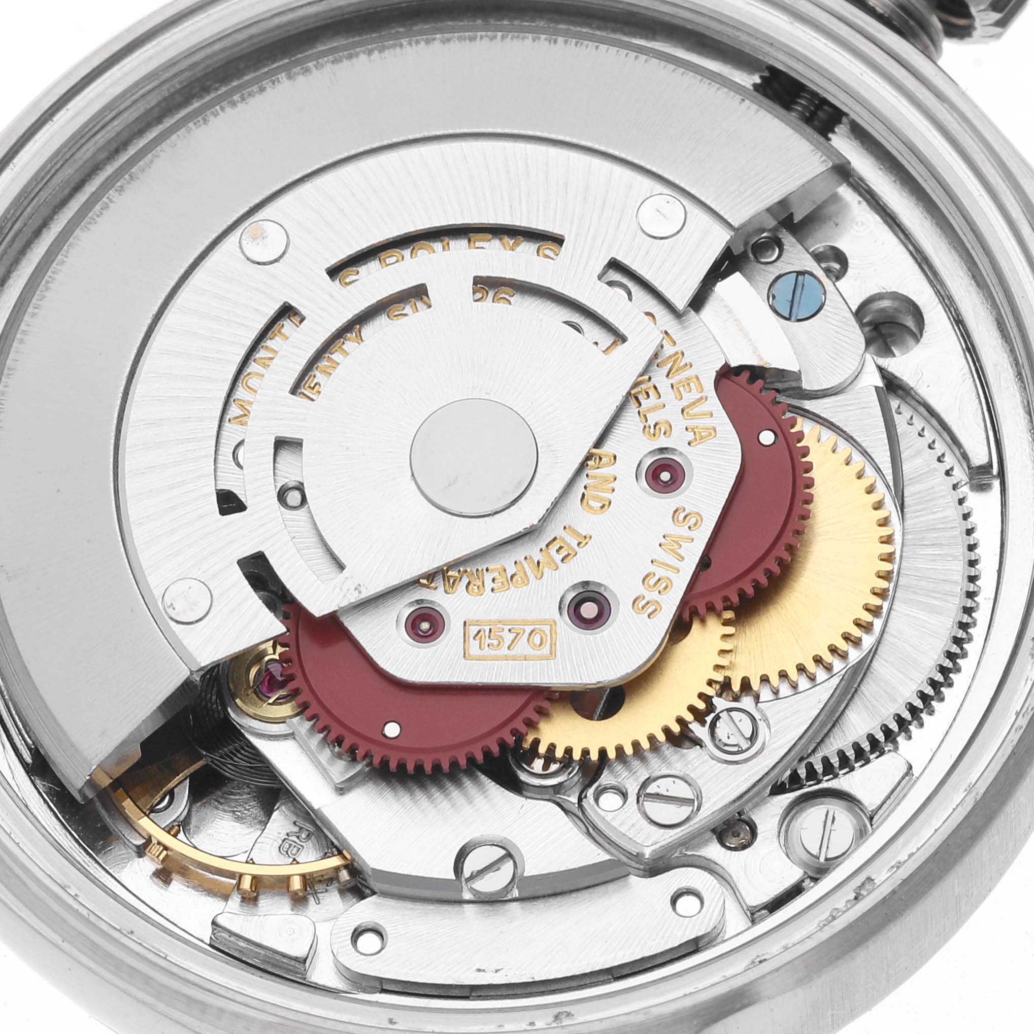 This image shows the internal mechanism of a Rolex Vintage Collection 1601 Men's Stainless Steel Silver Dial 1601 Men's Stainless Steel Silver Dial watch with gears and components visible.