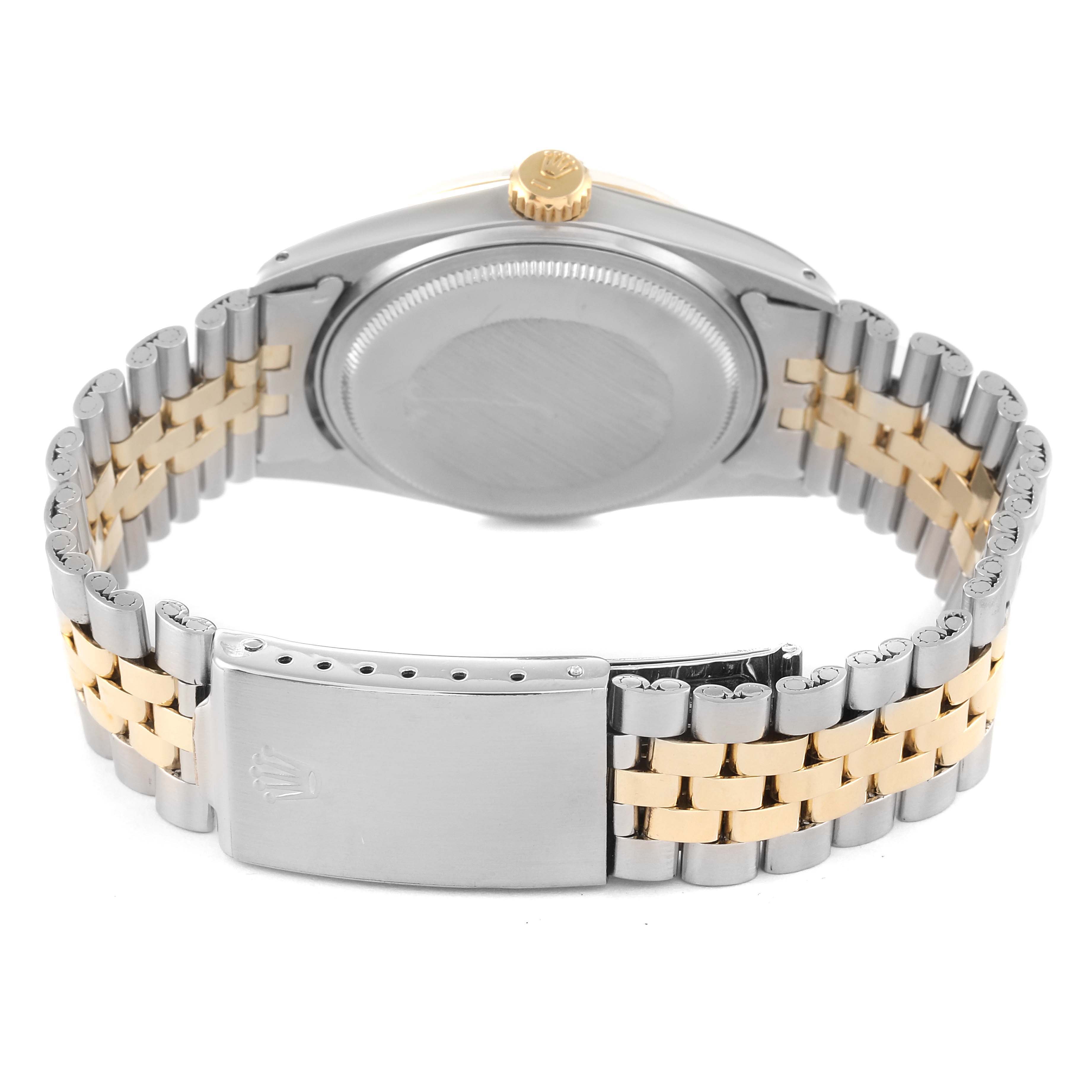 The image shows the back view of a Rolex Datejust 1601 Men's Steel and Gold (two tone) Champagne Dial 1601 Men's Steel and Gold (two tone) Champagne Dial watch, highlighting the case, crown, and the two-tone metal bracelet.