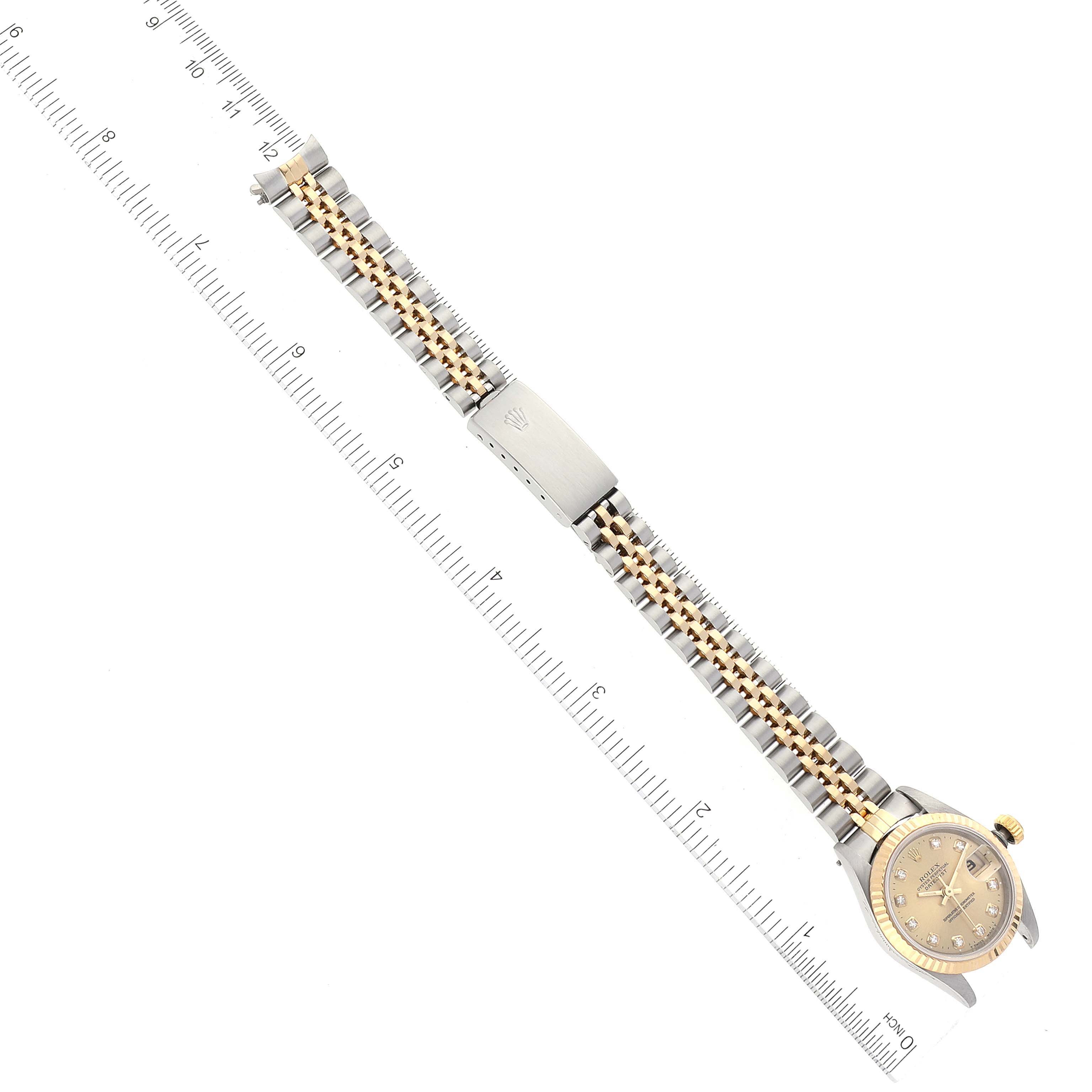 This image shows a Rolex Datejust 69173 Women's Steel and Gold (two tone) Champagne Dial 69173 Women's Steel and Gold (two tone) Champagne Dial watch laid flat, displaying the bracelet, clasp, and watch face from a top-down perspective.