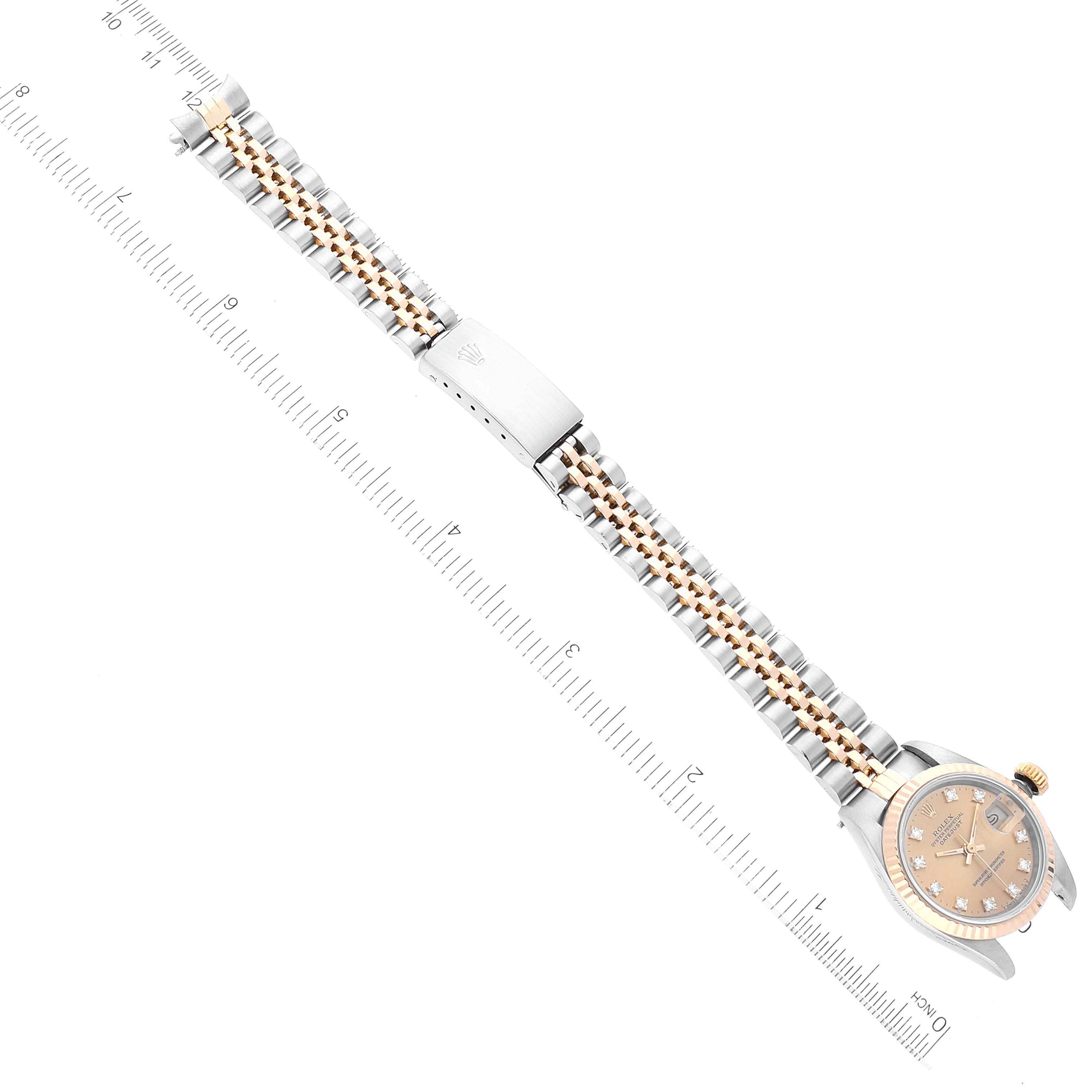The image shows the Rolex Datejust 69173 Women's Steel and Gold (two tone) Champagne Dial 69173 Women's Steel and Gold (two tone) Champagne Dial watch laid flat with the face and full bracelet visible, taken from an overhead angle.