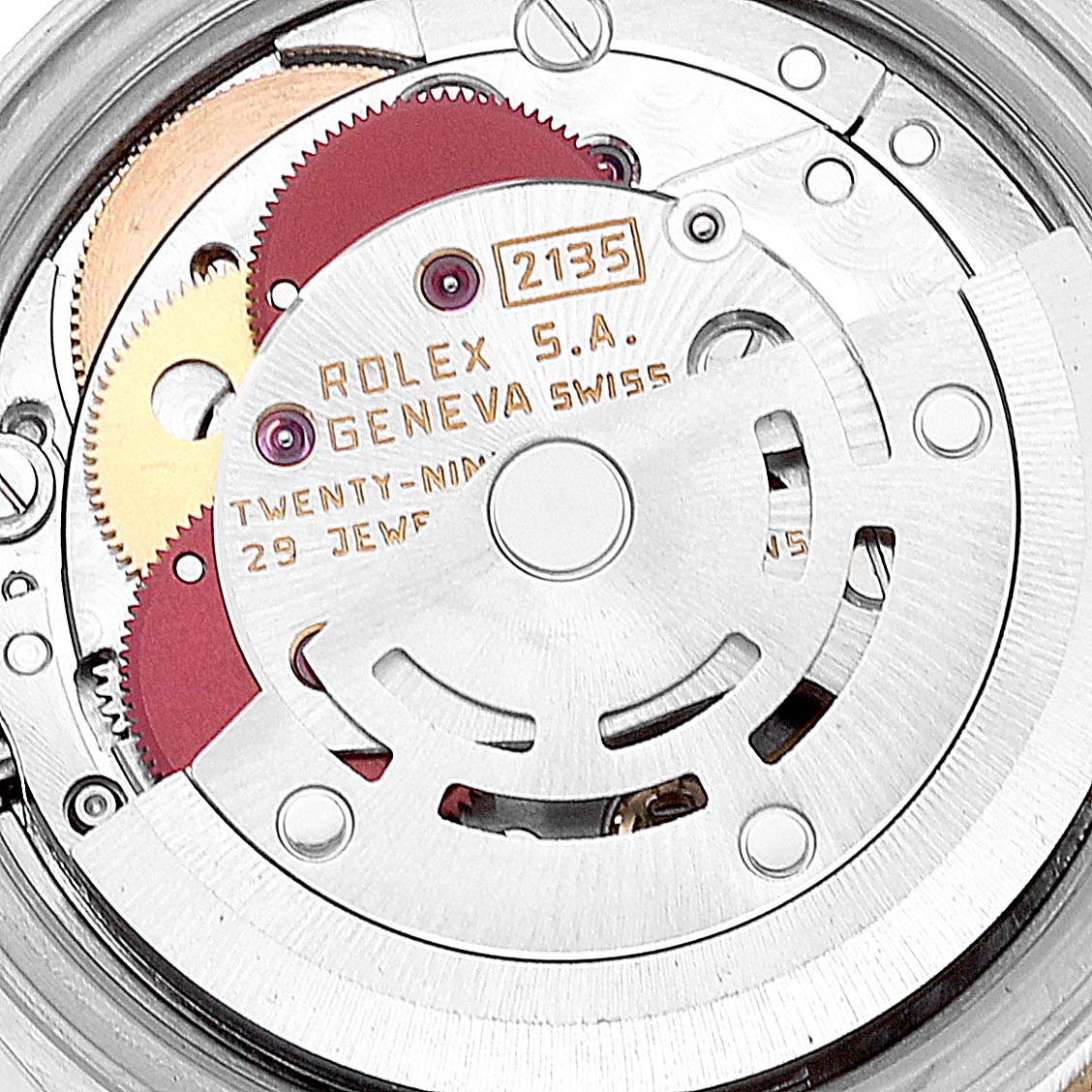 This image shows the intricate internal movement parts of a Rolex Datejust 69173 Women's Steel and Gold (two tone) Champagne Dial 69173 Women's Steel and Gold (two tone) Champagne Dial model, highlighting gears and the rotor.