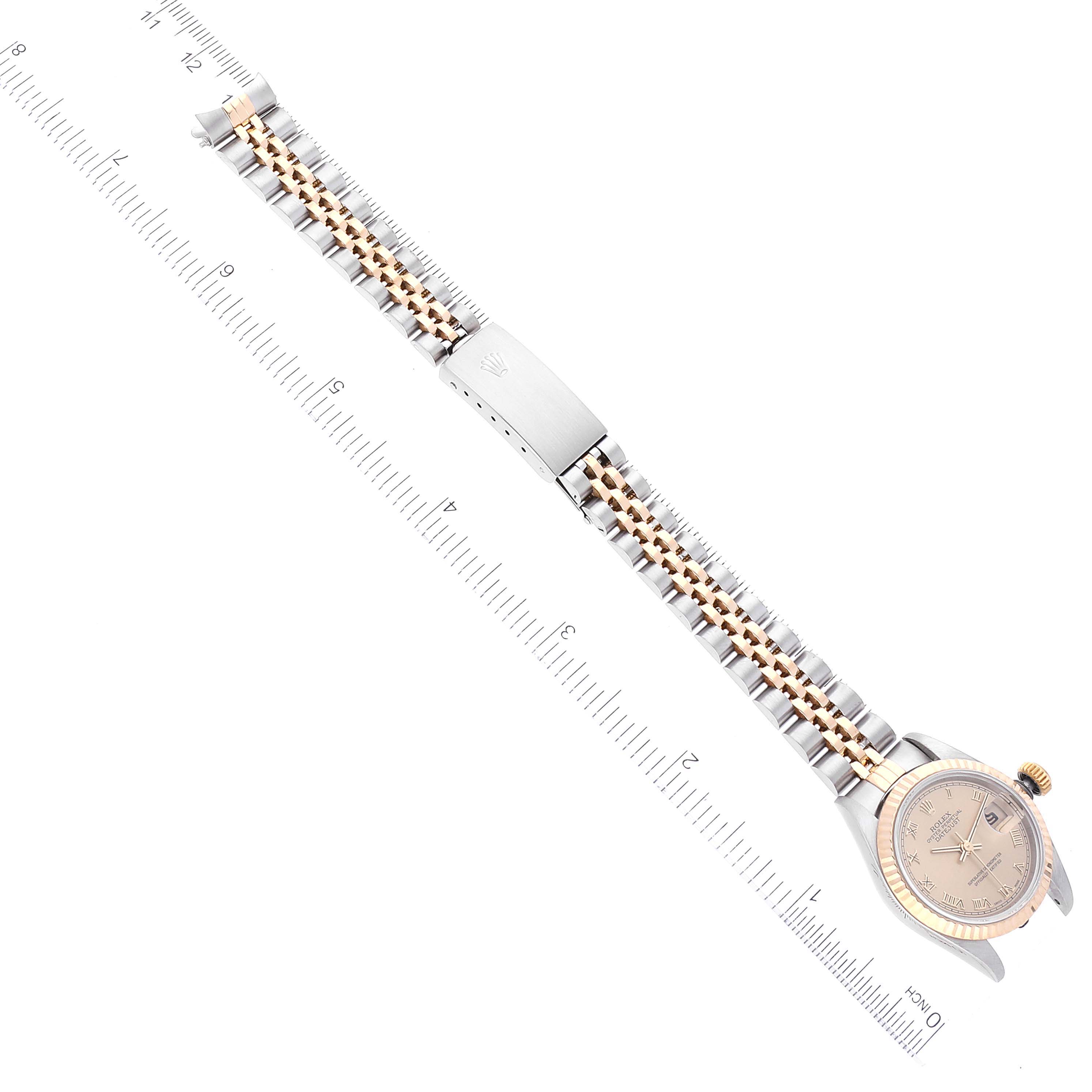 The image shows an overhead view of a Rolex Datejust 69173 Women's Steel and Gold (two tone) Champagne Dial 69173 Women's Steel and Gold (two tone) Champagne Dial watch, displaying its full bracelet, clasp, and watch face.