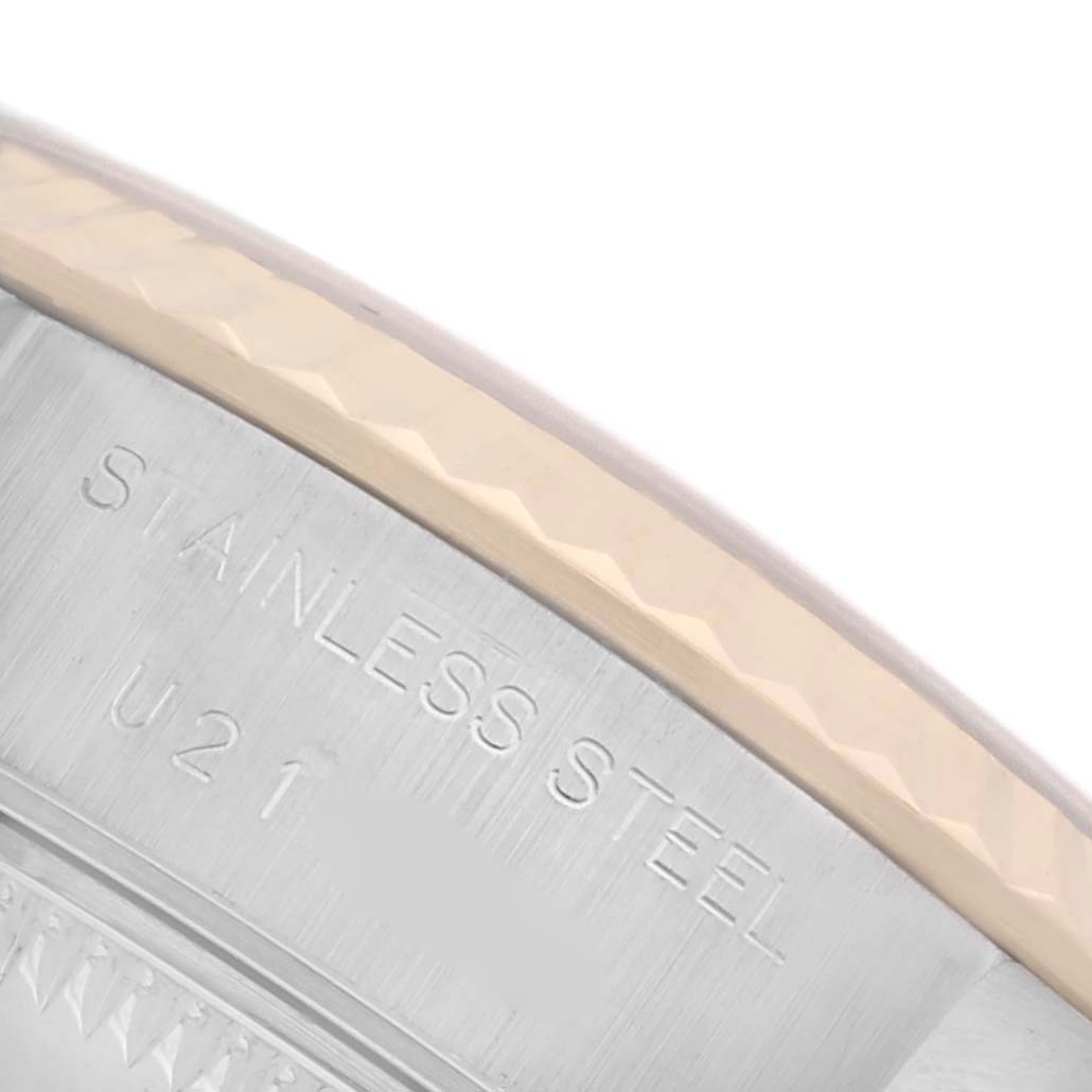 The image shows a close-up of the engraved bezel and edge of the Rolex Datejust 69173 Women's Steel and Gold (two tone) Champagne Dial 69173 Women's Steel and Gold (two tone) Champagne Dial watch, highlighting the inscription "STAINLESS STEEL."
