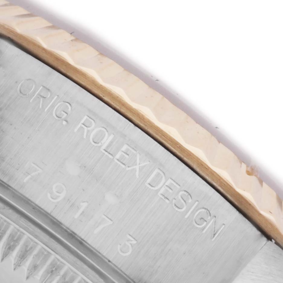 The image shows a close-up of the case side and bezel of a Rolex Datejust 79173 Women's Steel and Gold (two tone) Champagne Dial 79173 Women's Steel and Gold (two tone) Champagne Dial watch, displaying "ORIG. ROLEX DESIGN" and the serial number.