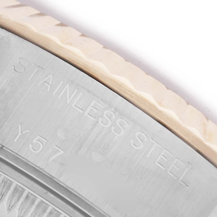 The image shows a close-up of the stainless steel bezel and case edge of a Rolex Datejust 79173 Women's Steel and Gold (two tone) Champagne Dial 79173 Women's Steel and Gold (two tone) Champagne Dial watch.