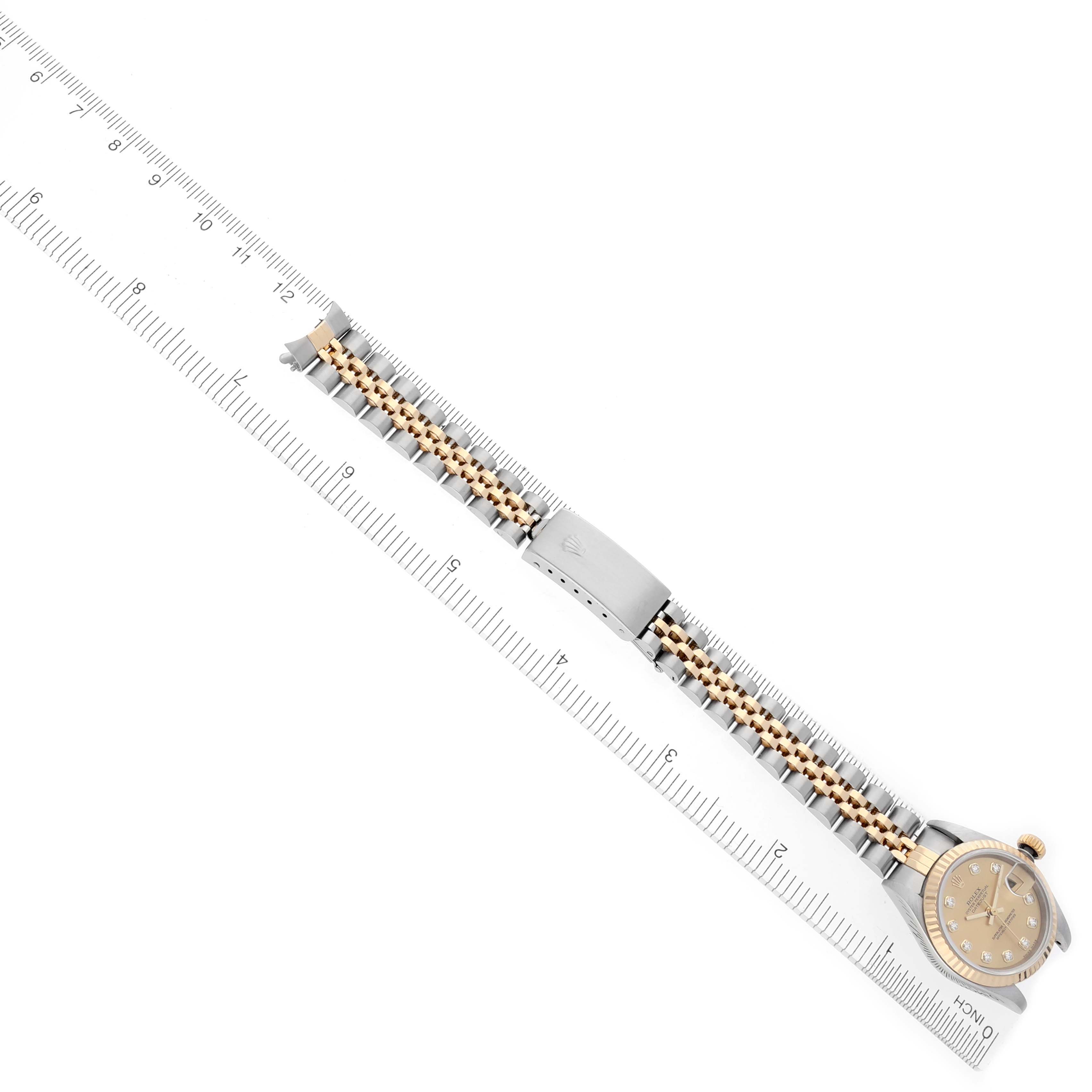 The Rolex Datejust 79173 Women's Steel and Gold (two tone) Champagne Dial 79173 Women's Steel and Gold (two tone) Champagne Dial watch is shown at a diagonal angle, displaying the bracelet, clasp, and watch face.