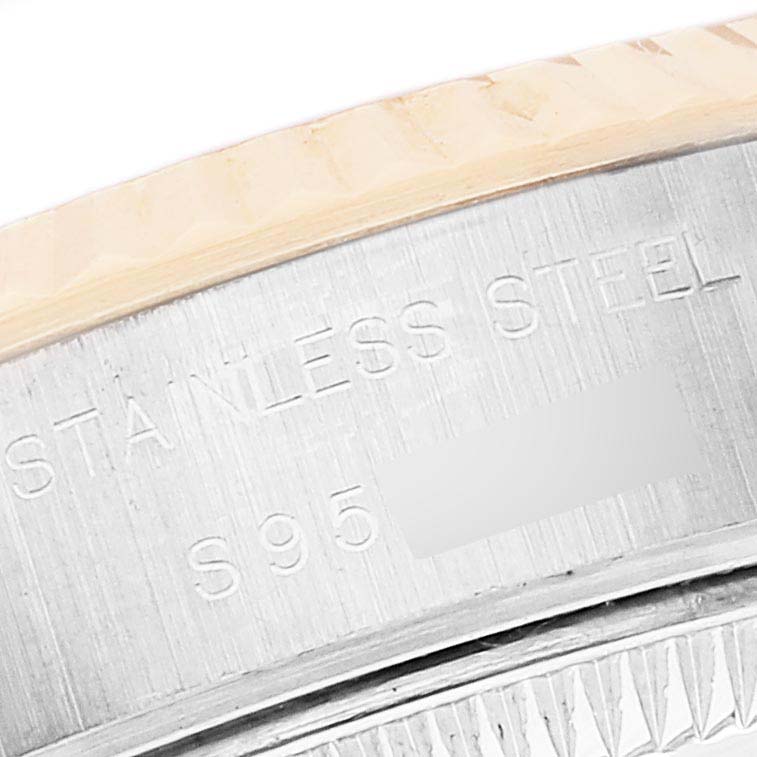 This image shows a close-up of the side of the stainless steel case of a Rolex Datejust 69173 Women's Steel and Gold (two tone) Grey Dial 69173 Women's Steel and Gold (two tone) Grey Dial watch, focusing on the engraved text.