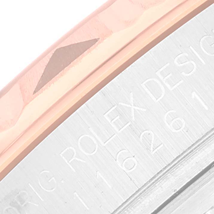 This image shows the bezel and part of the case back of a Rolex Turn-o-Graph 116261 Men's Steel and Gold (two tone) Black Dial 116261 Men's Steel and Gold (two tone) Black Dial model.