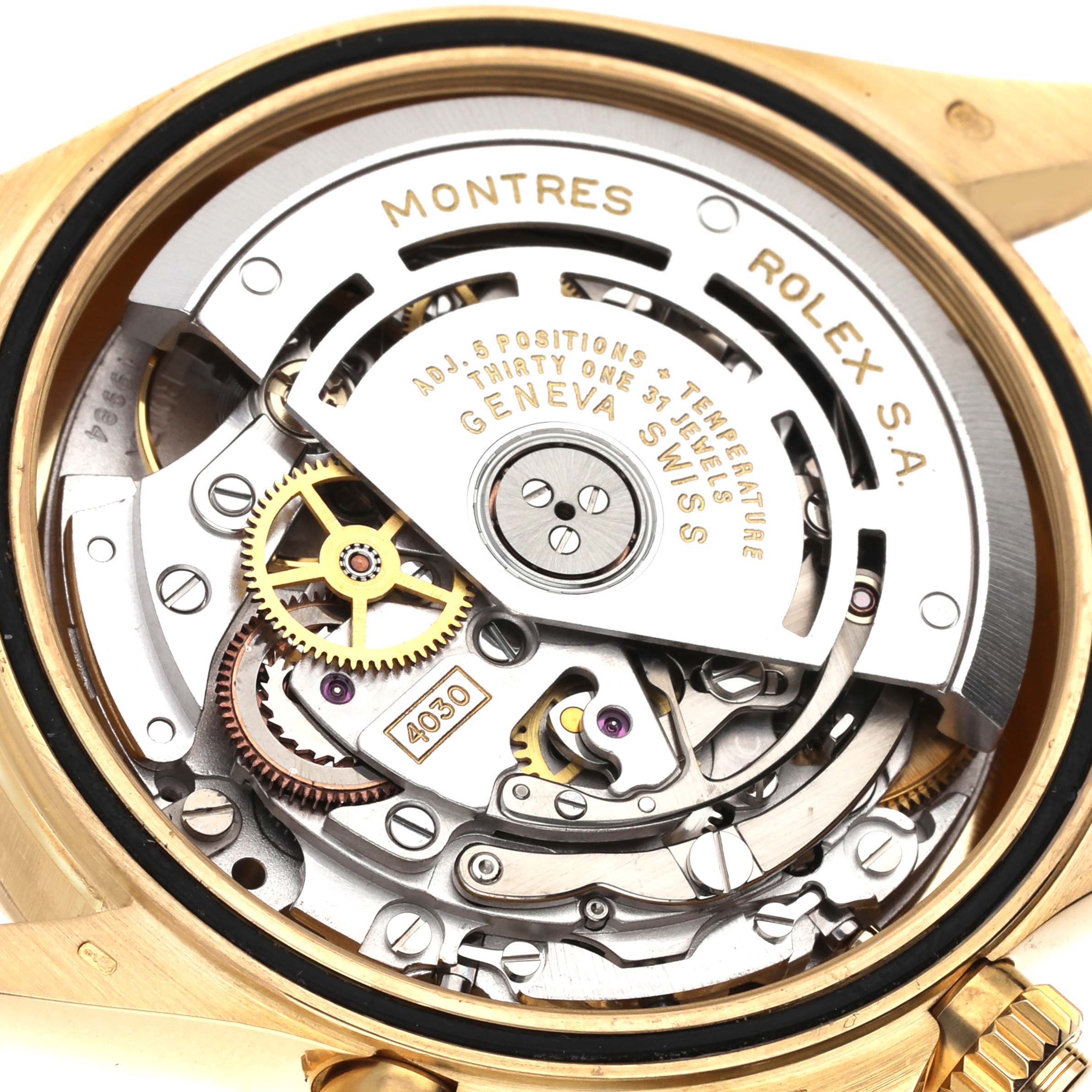 The image shows a close-up view of the internal mechanical movement of a Rolex Daytona 16528G Men's Yellow Gold Black Dial 16528G Men's Yellow Gold Black Dial watch.