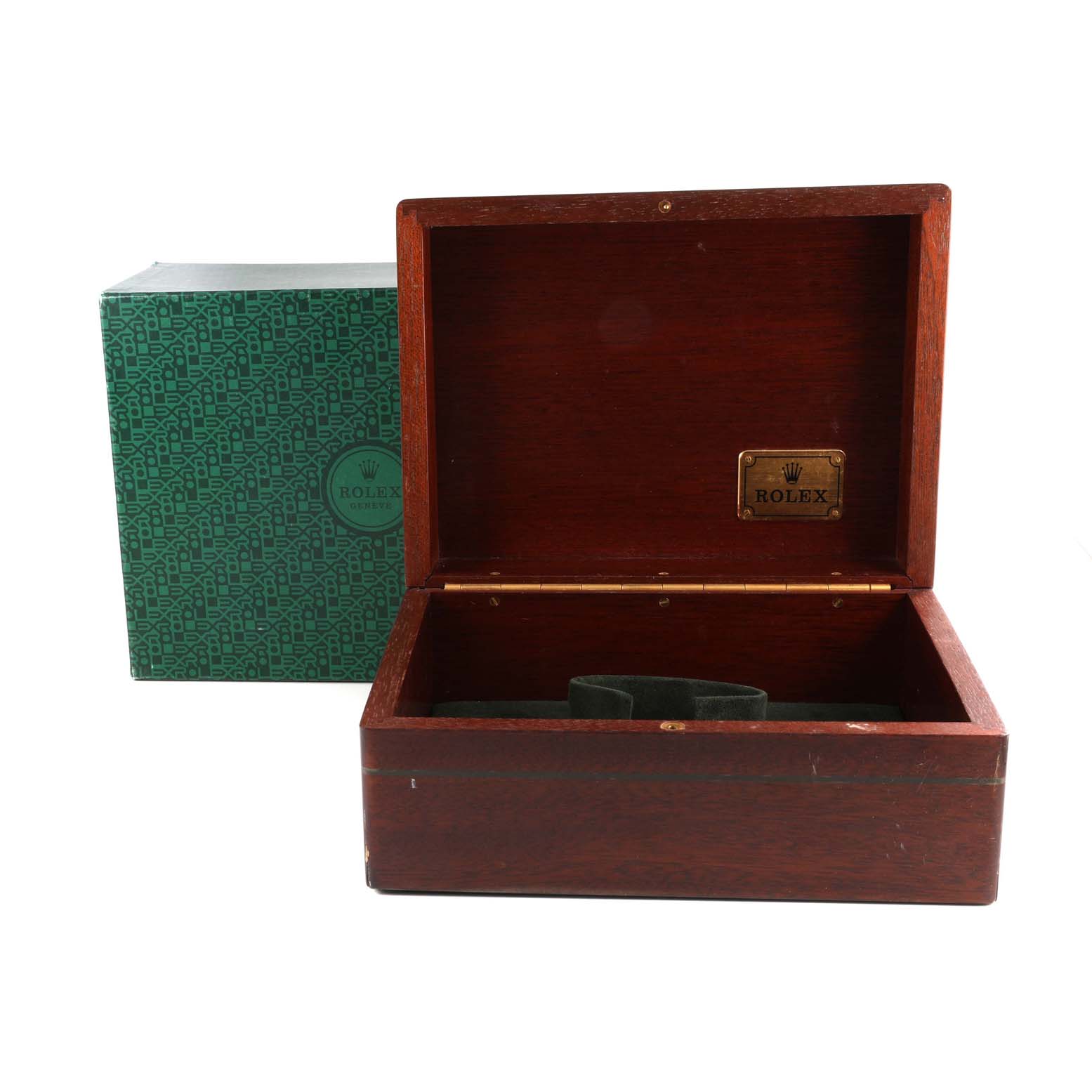 The image shows an open Rolex Daytona 16528G Men's Yellow Gold Black Dial 16528G Men's Yellow Gold Black Dial watch box with a green patterned outer box in the background.