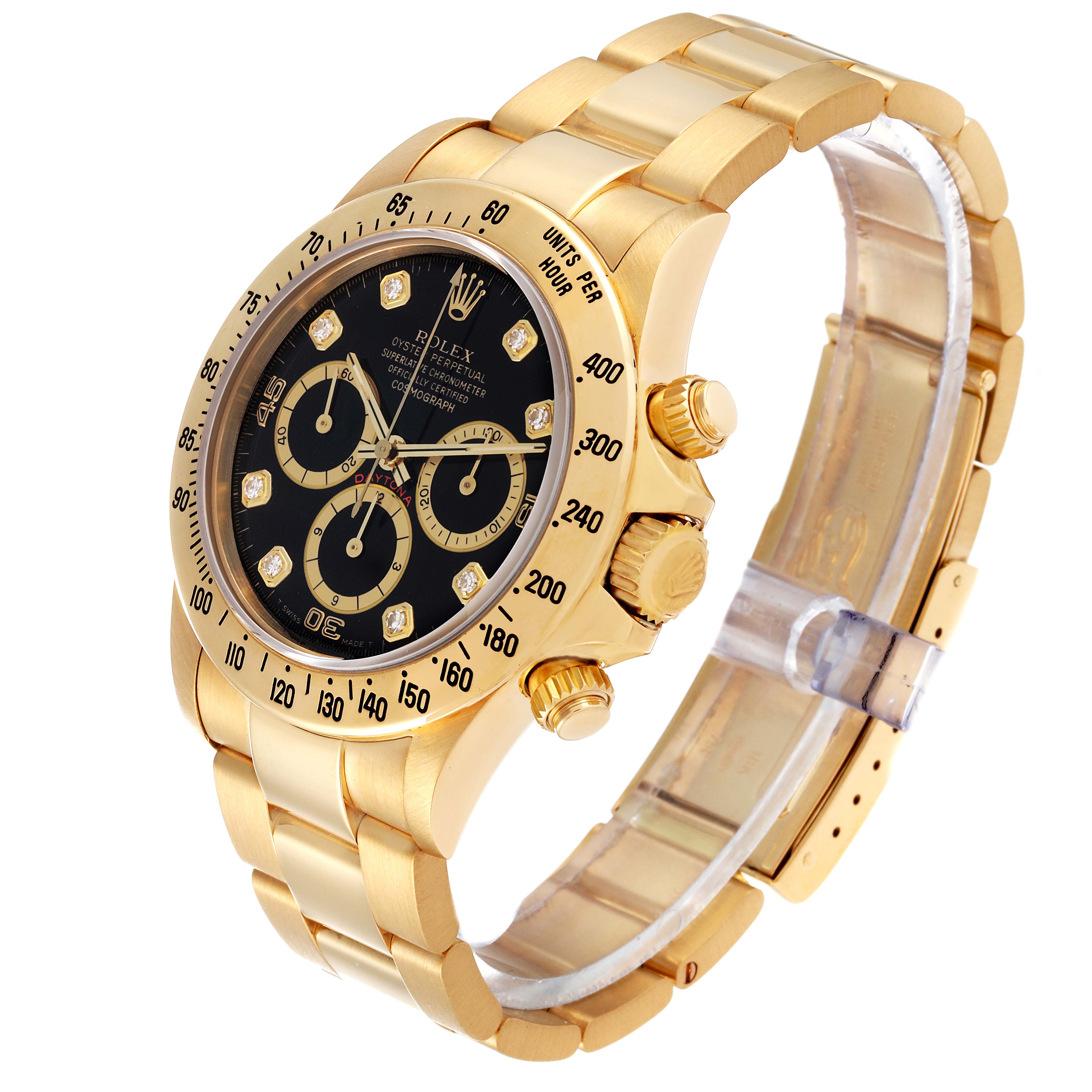 The image shows a Rolex Daytona 16528G Men's Yellow Gold Black Dial 16528G Men's Yellow Gold Black Dial watch at a slight angle, highlighting its gold bracelet, black dial, and chronograph sub-dials.