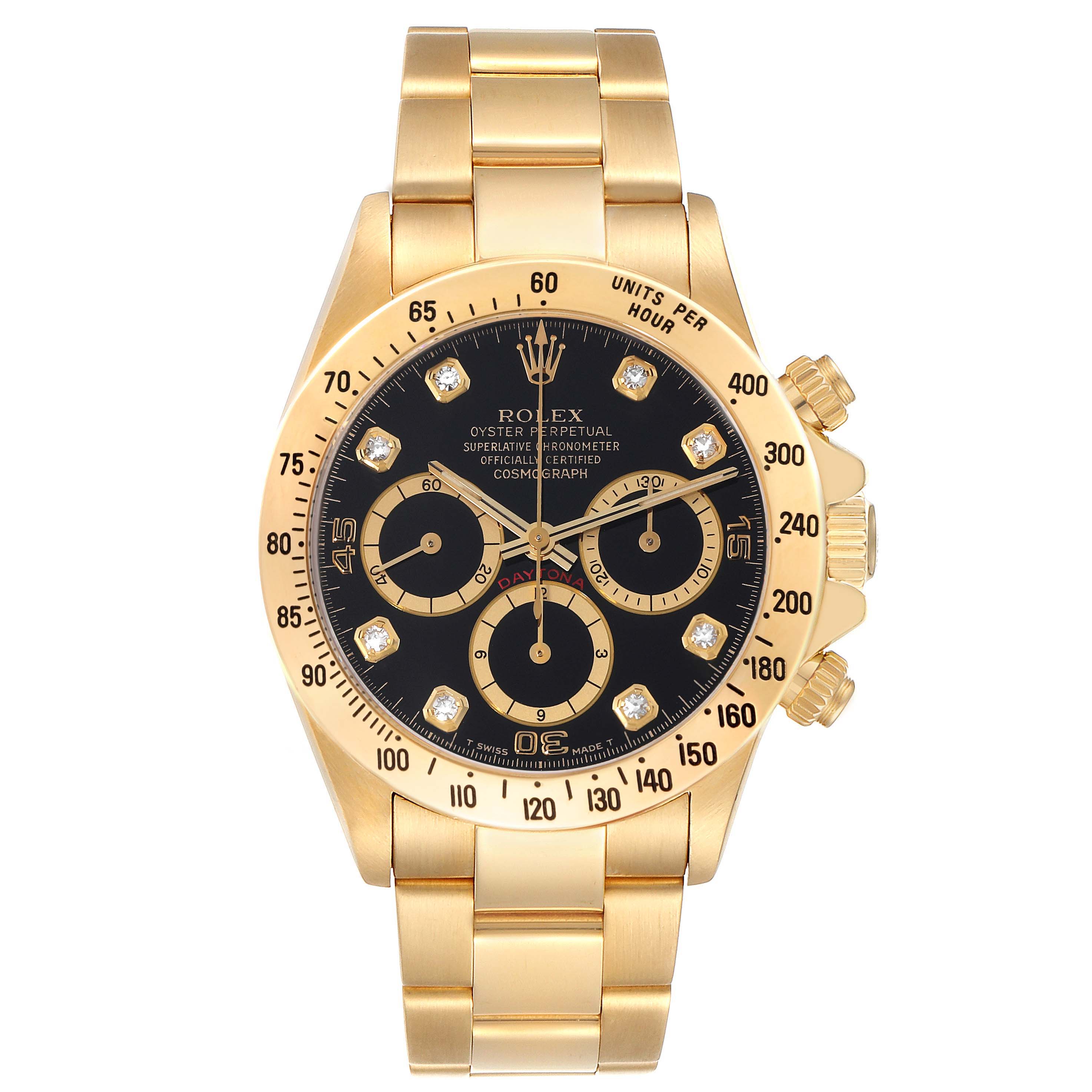 This image shows a front view of a Rolex Daytona 16528G Men's Yellow Gold Black Dial 16528G Men's Yellow Gold Black Dial watch with a gold bracelet, black dial, and three sub-dials.