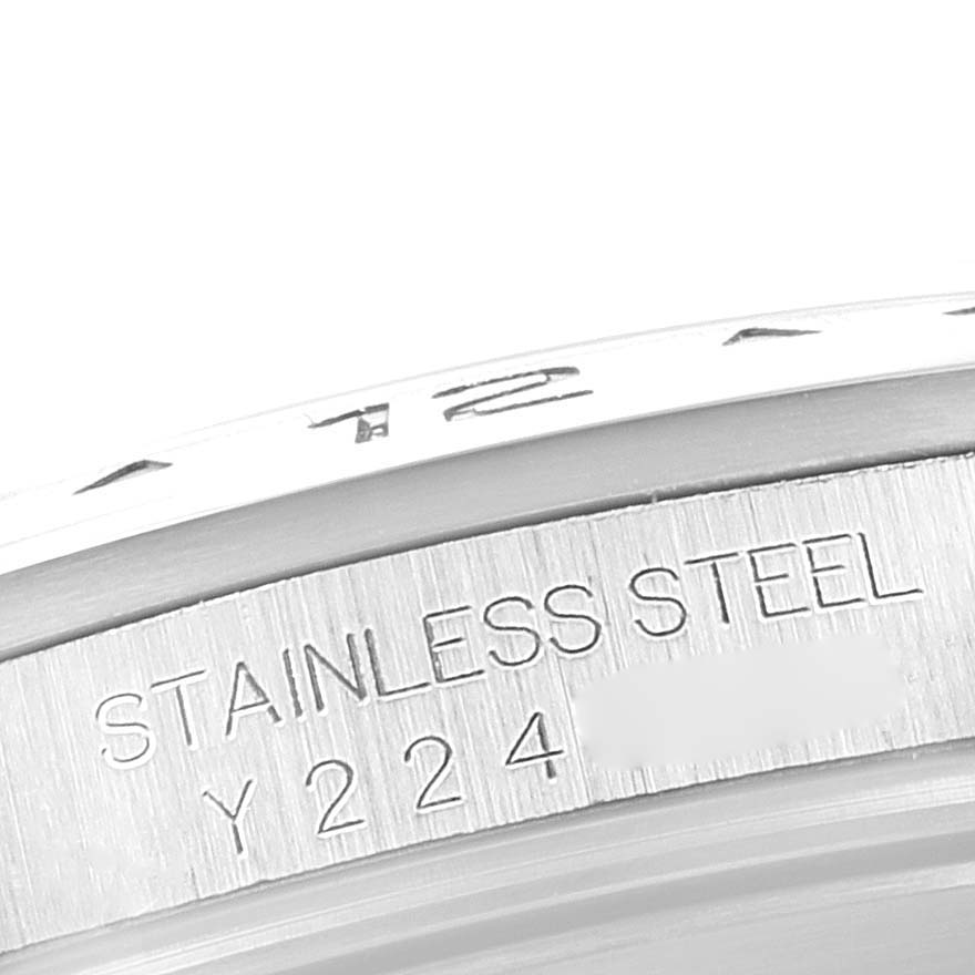 The image shows a close-up of the case back, indicating "STAINLESS STEEL" and a serial number on the Rolex Explorer 16570 Men's Stainless Steel Black Dial 16570 Men's Stainless Steel Black Dial model.