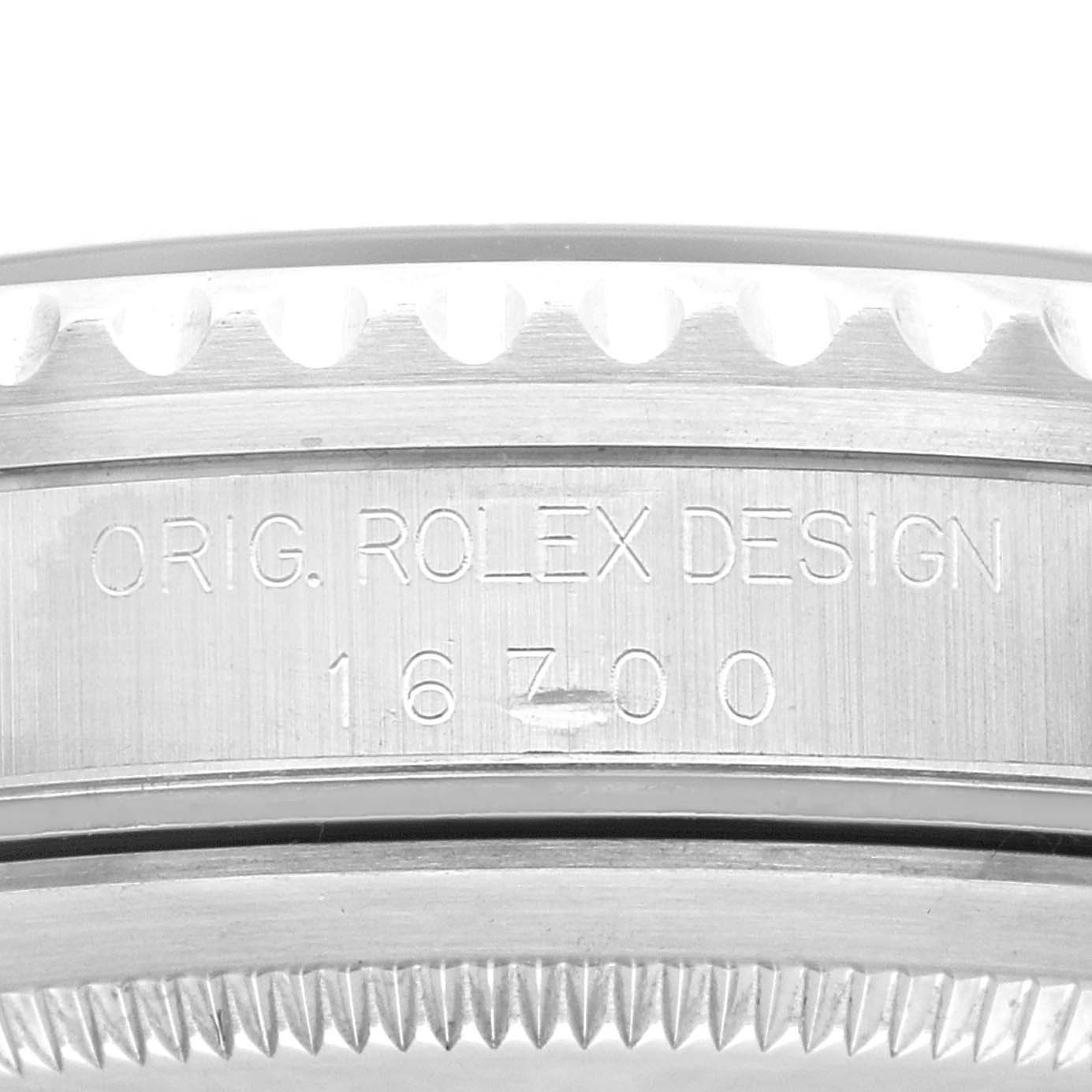 The image shows the side view of the case, including the bezel and serial number, of a Rolex GMT-Master 16700 Men
s Stainless Steel Black Dial 16700 Men
s Stainless Steel Black Dial model.
