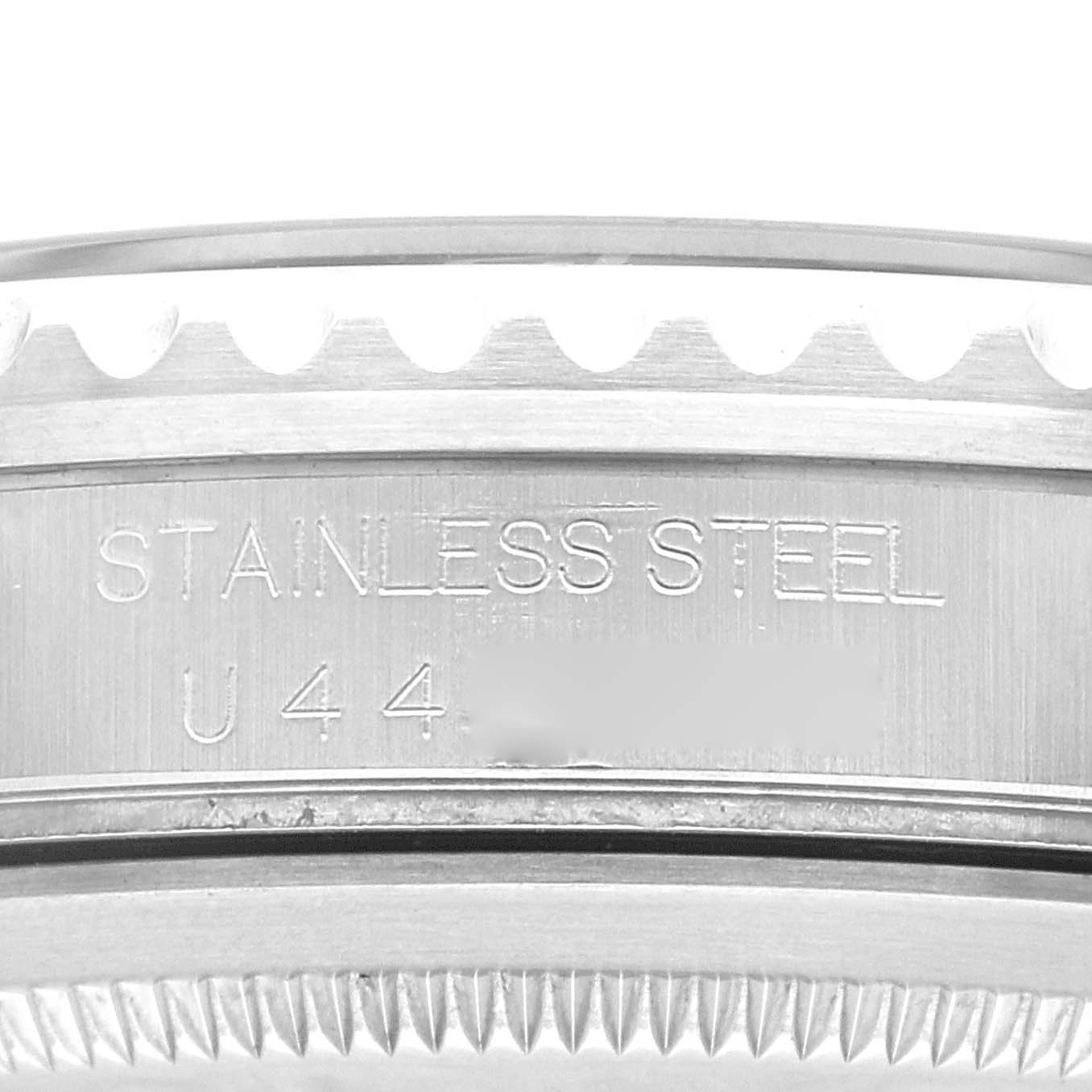 This image shows a close-up of the case back and bezel edge of a Rolex GMT-Master 16700 Men
s Stainless Steel Black Dial 16700 Men
s Stainless Steel Black Dial, highlighting the "STAINLESS STEEL" engraving.