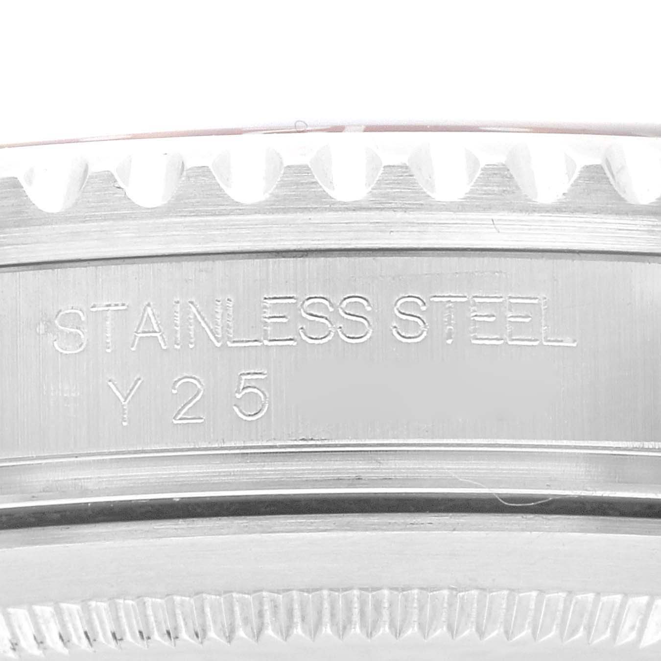This close-up image shows the side of the stainless steel bezel and engraved details of a Rolex GMT-Master 16710 Men's Stainless Steel Black Dial 16710 Men's Stainless Steel Black Dial watch.