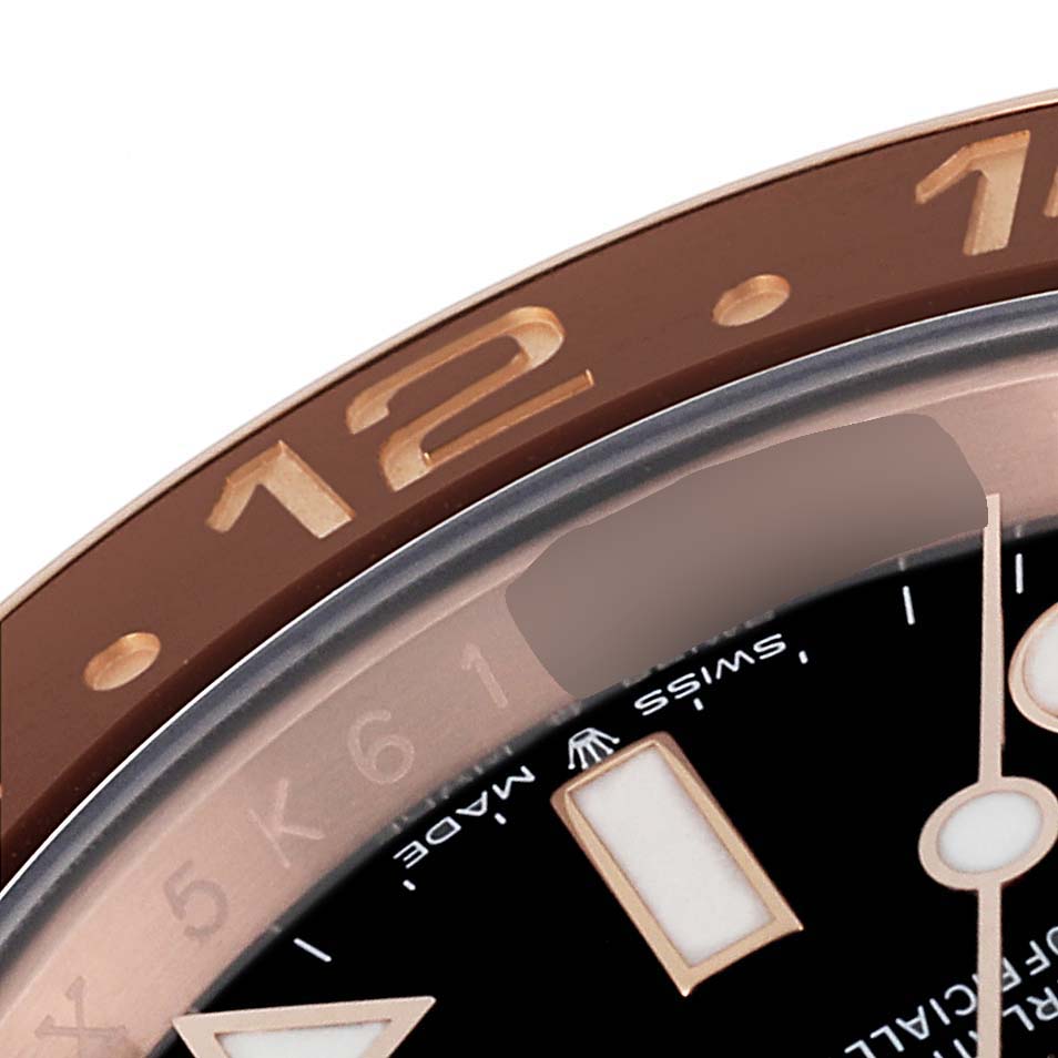 The image shows a close-up of the bezel, dial, and part of the hour hand of a Rolex GMT-Master 126715 Men's Rose Gold Black Dial 126715 Men's Rose Gold Black Dial watch.