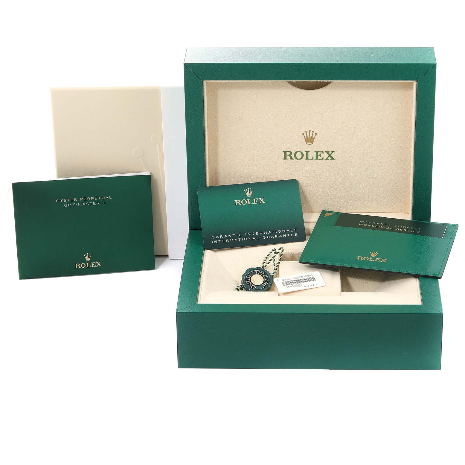 The image shows the packaging and accessories for a Rolex GMT-Master 126715 Men's Rose Gold Black Dial 126715 Men's Rose Gold Black Dial II, including the box, booklets, and tags.