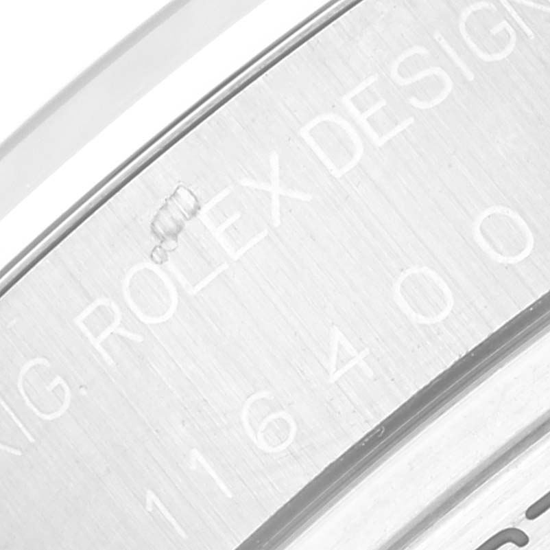 The image shows a close-up of the case back of a Rolex Milgauss 116400 Men's Stainless Steel White Dial 116400 Men's Stainless Steel White Dial, highlighting the model and brand engravings.
