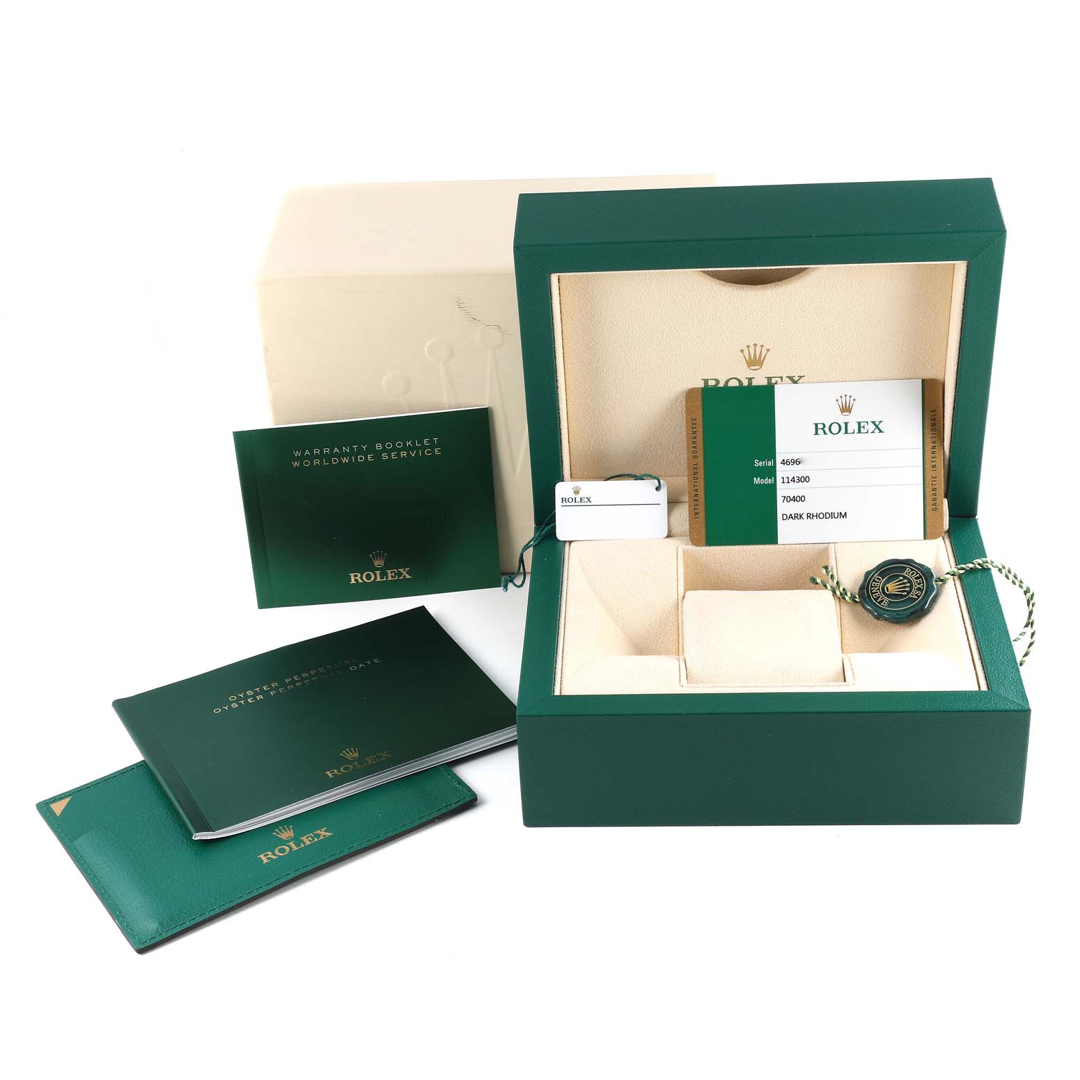 The image shows the packaging, warranty booklet, tags, and papers for a Rolex Oyster Perpetual 114300 Men's Stainless Steel Grey Dial 114300 Men's Stainless Steel Grey Dial watch.