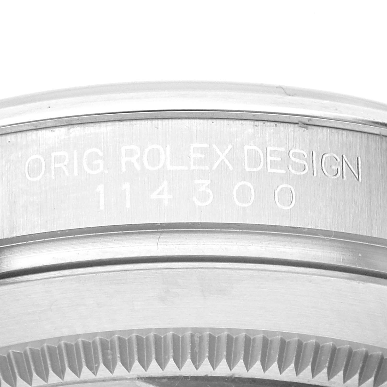 This close-up image shows the side of the Rolex Oyster Perpetual 114300 Men's Stainless Steel Grey Dial 114300 Men's Stainless Steel Grey Dial watch, displaying the model number "114300".