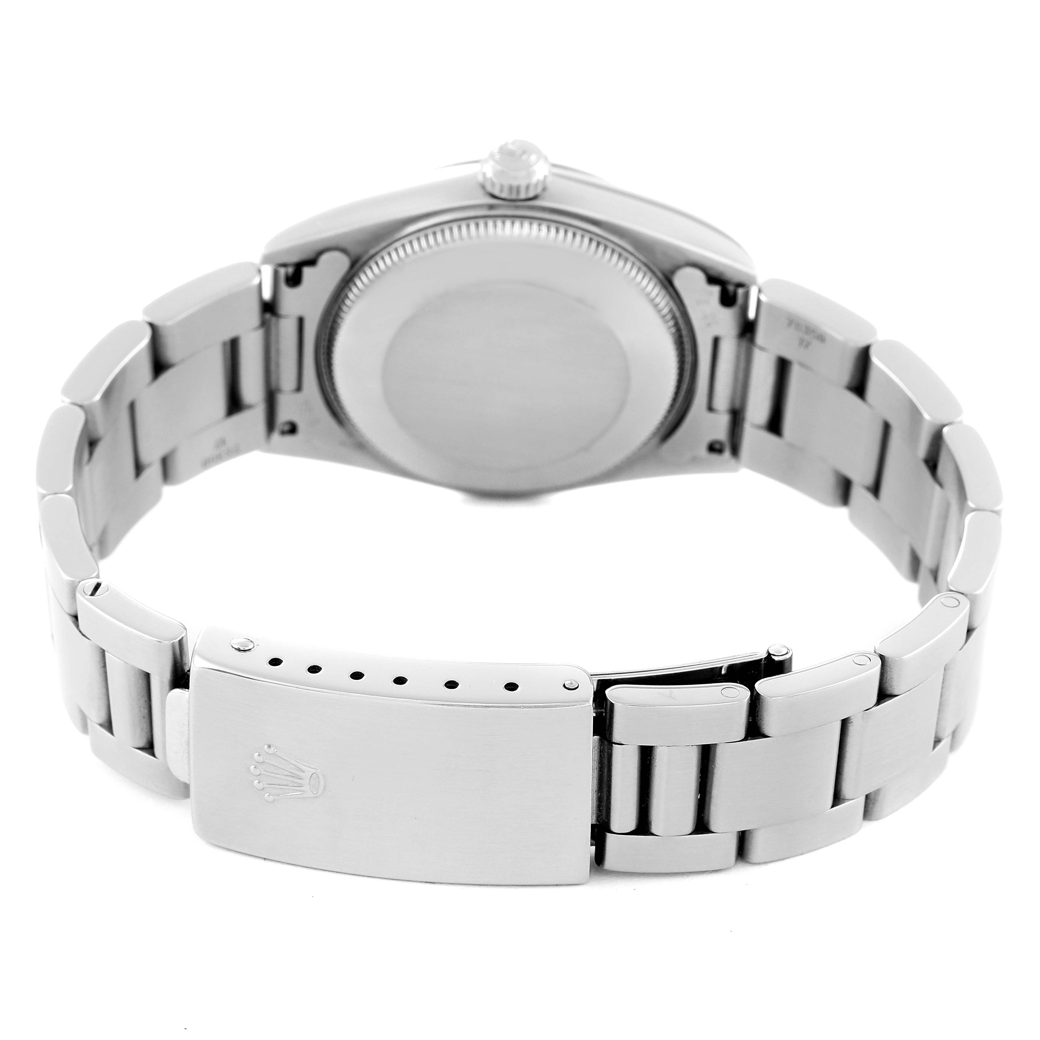 The image shows the back cover and closed clasp of a Rolex Mid-Size 77080 Women's Stainless Steel Blue Dial 77080 Women's Stainless Steel Blue Dial model watch.