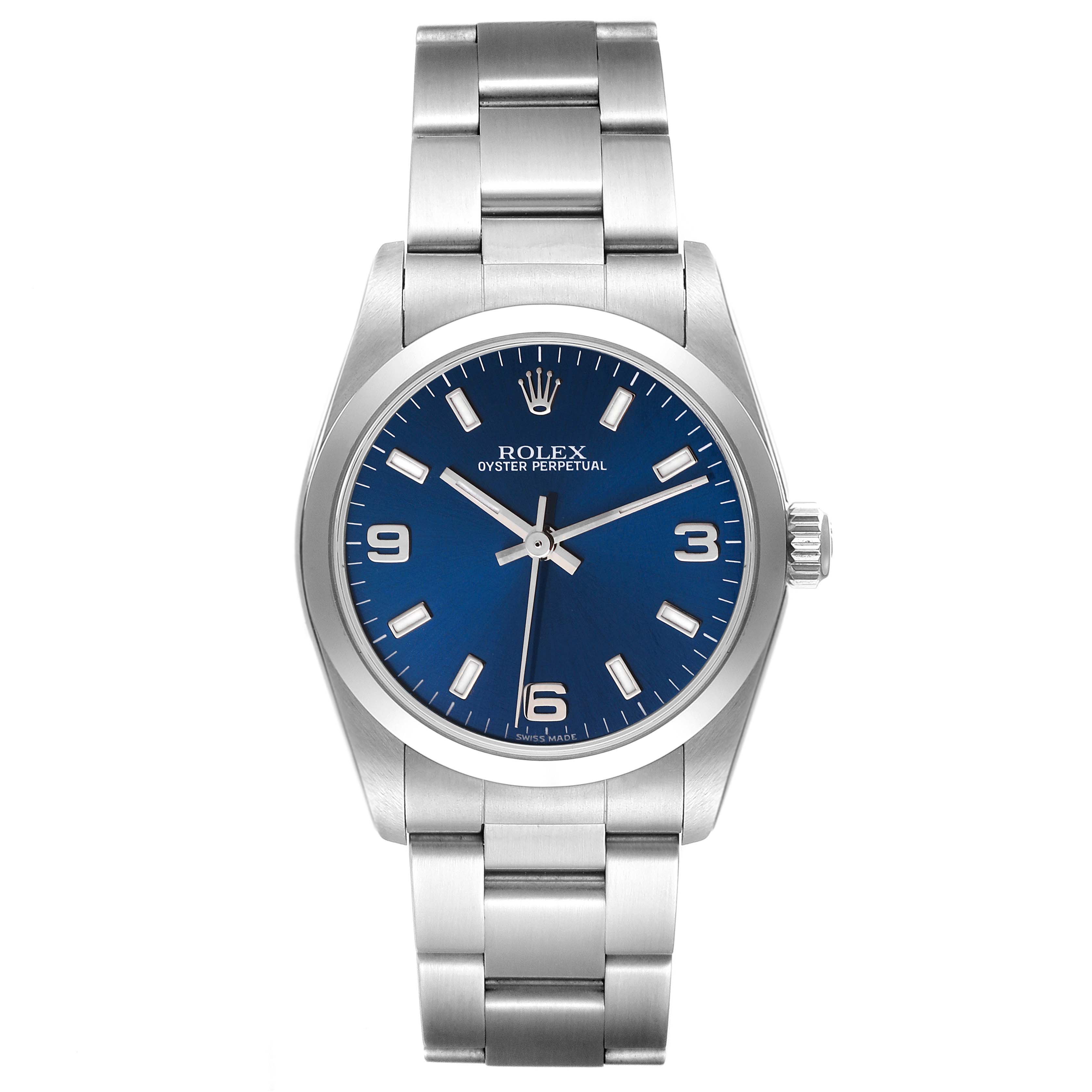 The image shows a front view of a Rolex Oyster Perpetual Mid-Size watch featuring a blue dial and stainless steel bracelet.