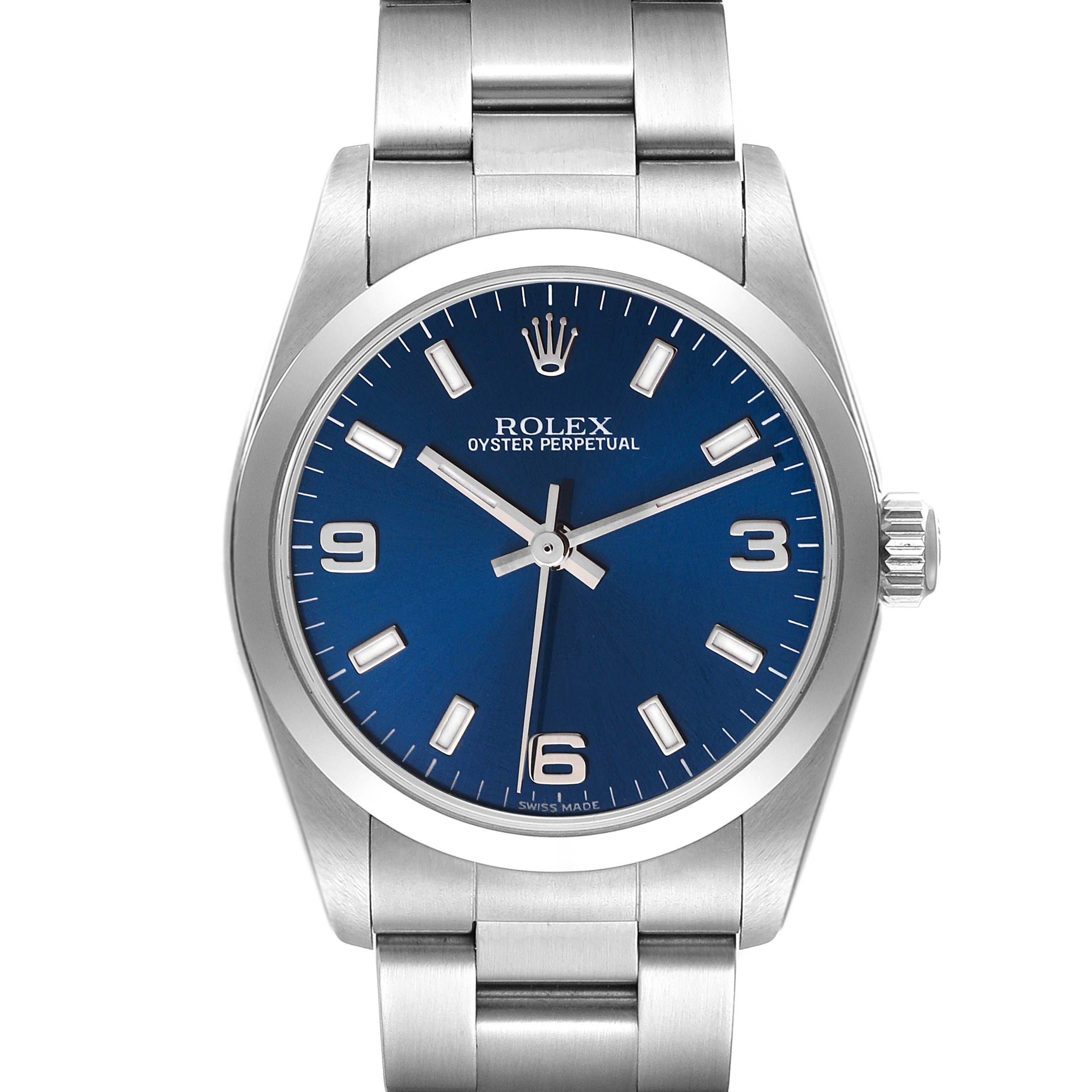 The image shows a front view of a Mid-Size Rolex Oyster Perpetual watch with a blue dial and stainless steel bracelet.