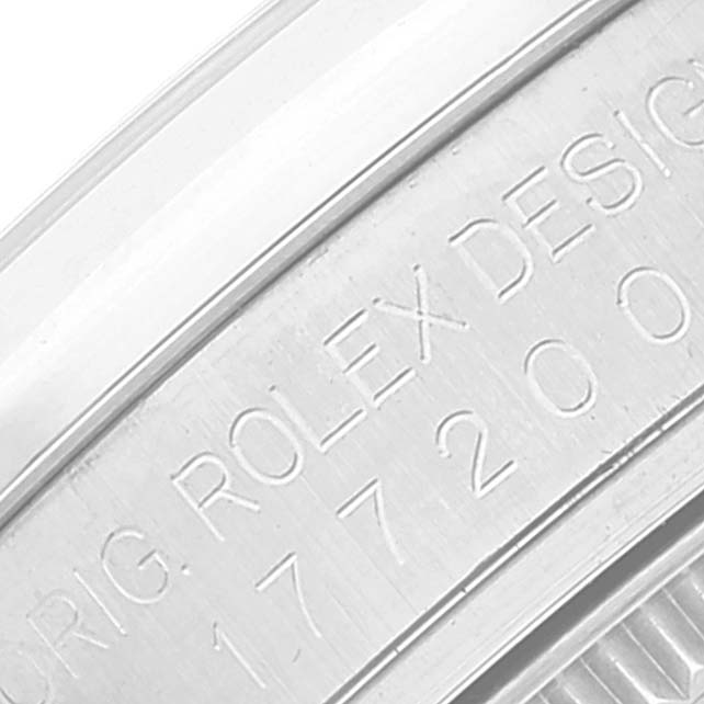 This close-up image shows the engraved side of a Mid-Size Rolex watch case, displaying the model number and brand name.