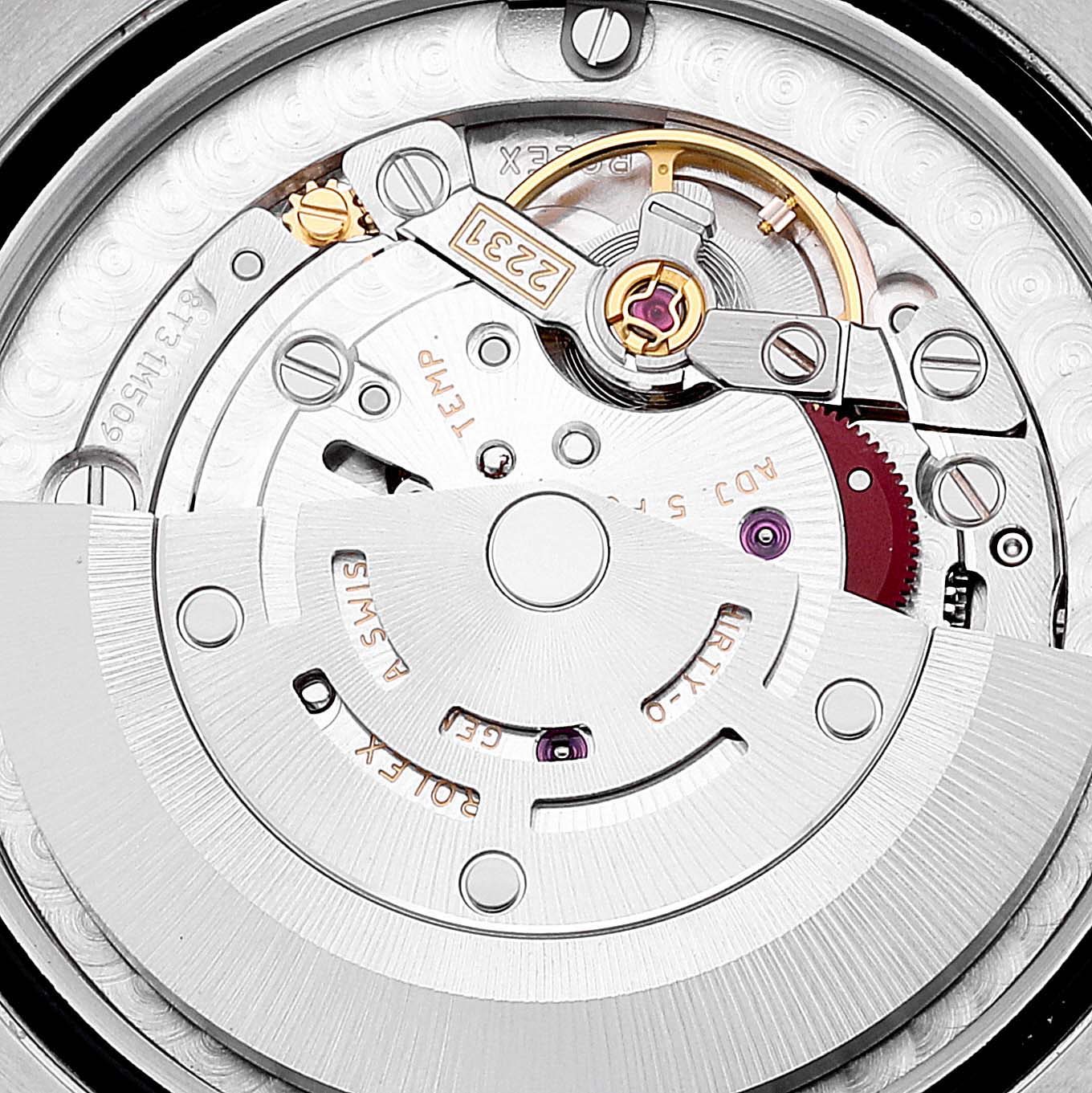 The image shows a close-up of the movement and internal mechanisms of a Mid-Size Rolex watch.