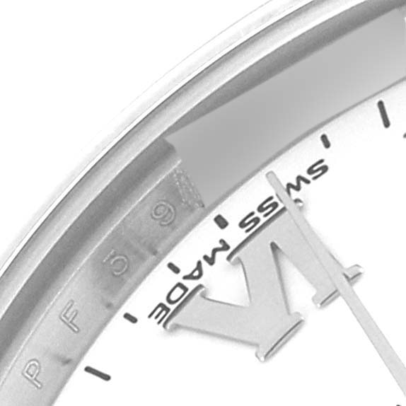 This close-up of the Rolex Mid-Size 177200 Women
s Stainless Steel White Dial 177200 Women
s Stainless Steel White Dial model features part of the dial and minute hand, showing the "Swiss Made" inscription.