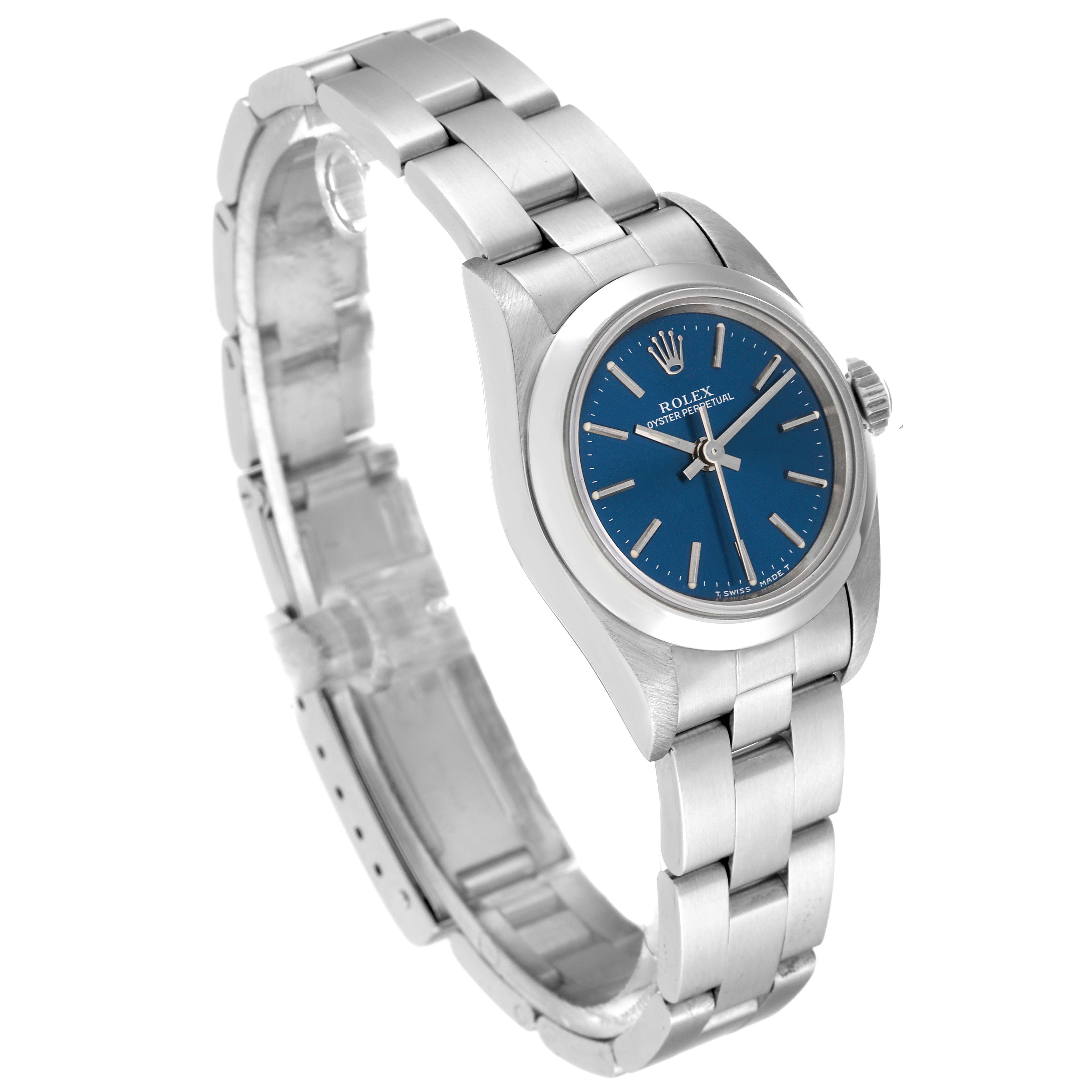 The Rolex Oyster Perpetual 67180 Women's Stainless Steel Blue Dial 67180 Women's Stainless Steel Blue Dial watch is shown from an oblique angle, highlighting the blue dial, case, and metal bracelet.