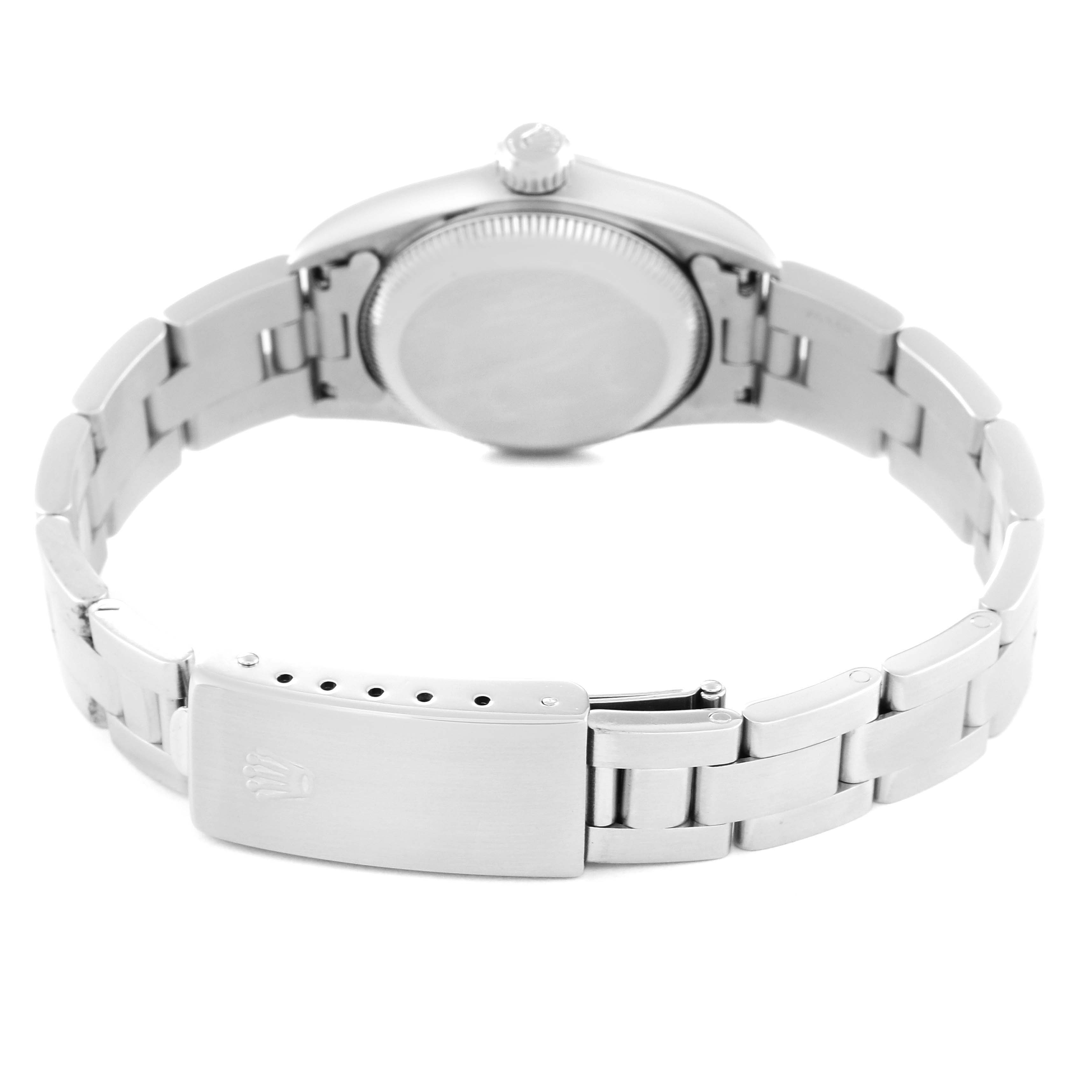 The image shows the back casing and bracelet clasp of the Rolex Oyster Perpetual 67180 Women's Stainless Steel Blue Dial 67180 Women's Stainless Steel Blue Dial watch in a partially open position.