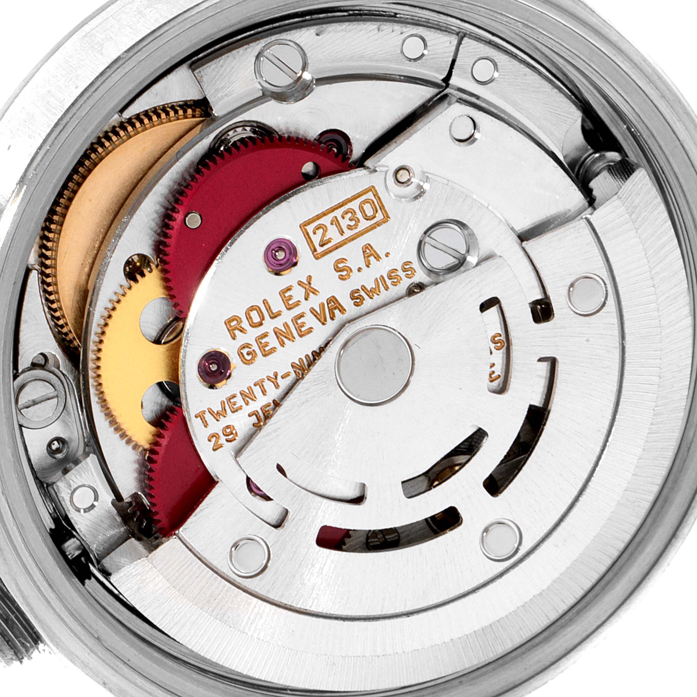 The image shows an up-close view of the internal mechanism of a Rolex Oyster Perpetual 67180 Women's Stainless Steel White Dial 67180 Women's Stainless Steel White Dial watch.