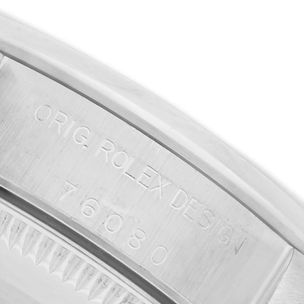 The image shows the engraved side of a Rolex Oyster Perpetual 76080 Women's Stainless Steel Pink Dial 76080 Women's Stainless Steel Pink Dial watch, focusing on the model details.