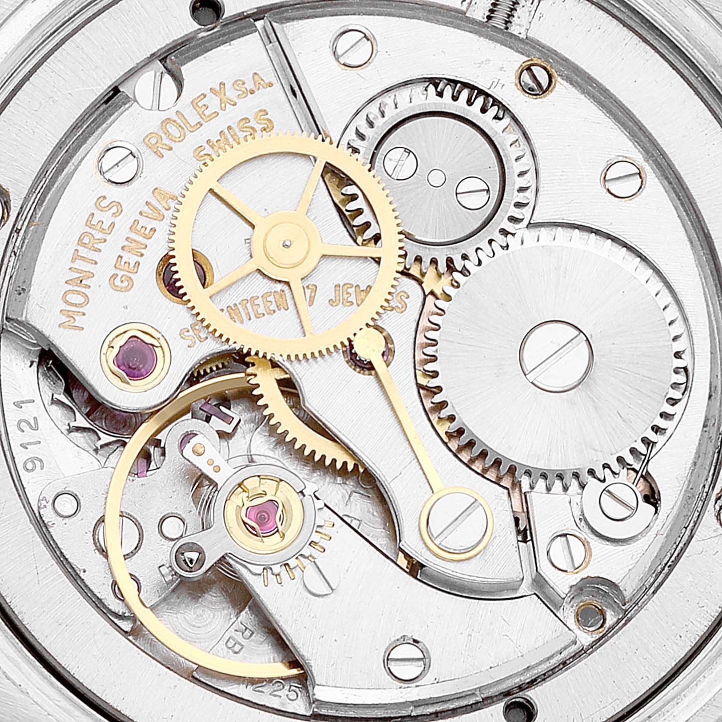 This is a close-up view of the inner mechanical movement of a Rolex Vintage Collection 6694 Men's Stainless Steel Black Dial 6694 Men's Stainless Steel Black Dial watch, showing gears and jewels.