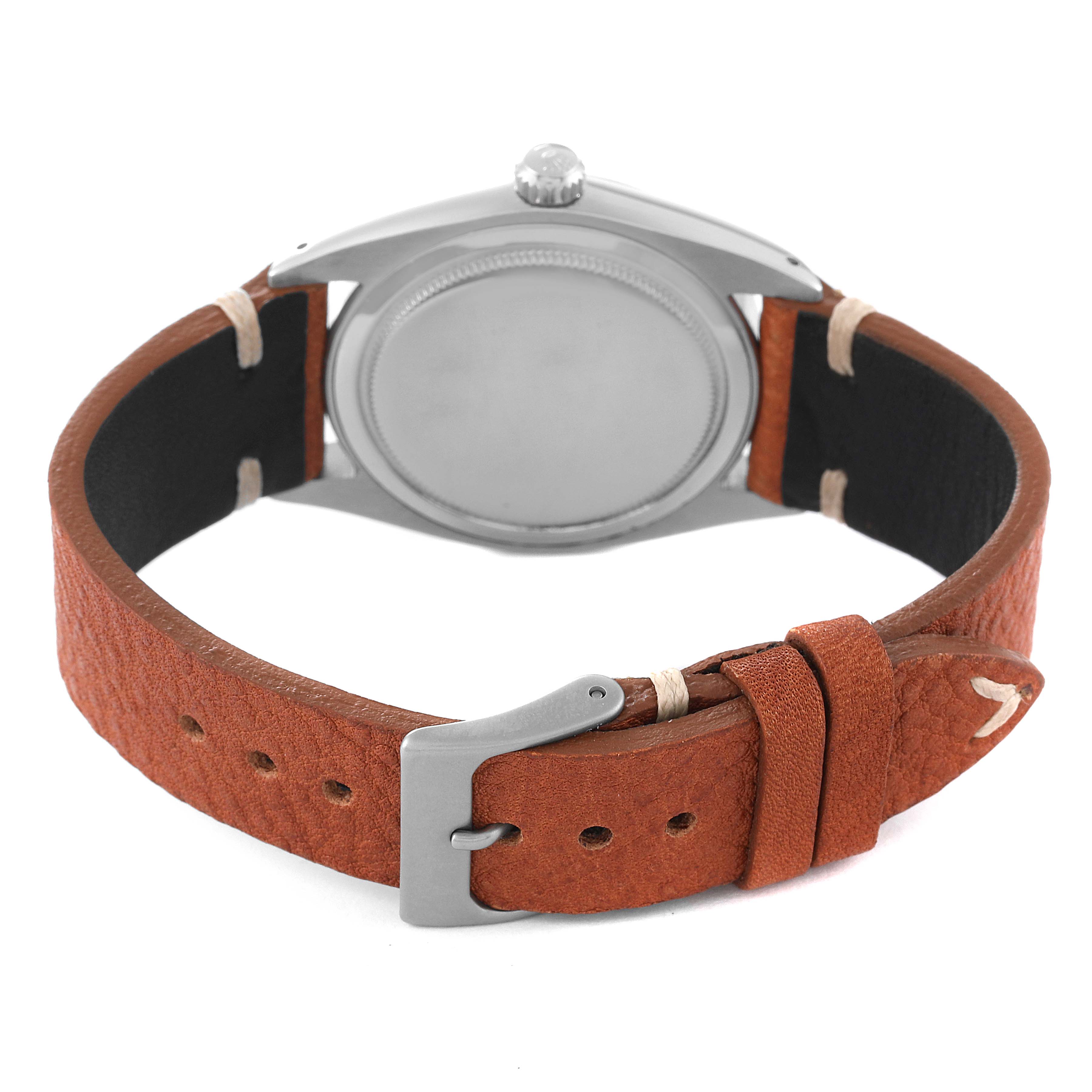 The Rolex Vintage Collection 6694 Men's Stainless Steel Brown Dial 6694 Men's Stainless Steel Brown Dial watch is shown from the back, highlighting the case back and brown leather strap with a buckle.