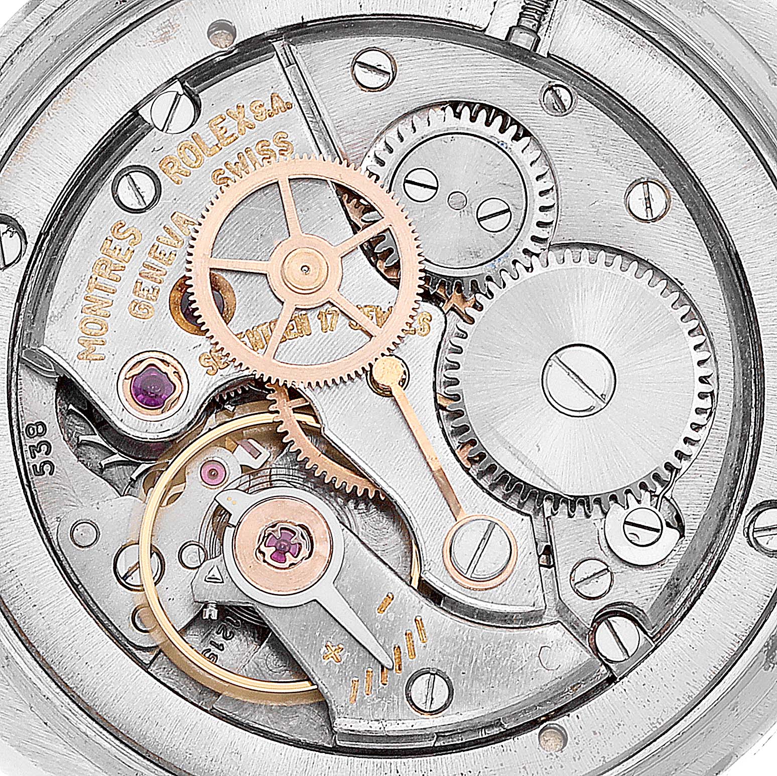 This image shows the intricate internal mechanism of the Vintage Collection model by Rolex, focusing on the gears and movement components.