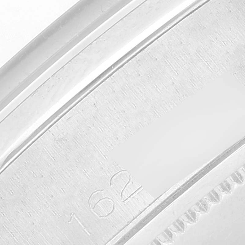 This image shows a close-up of the casing and serial number area of the Rolex Vintage Collection 6694 Men
s Stainless Steel Silver Dial 6694 Men
s Stainless Steel Silver Dial watch.
