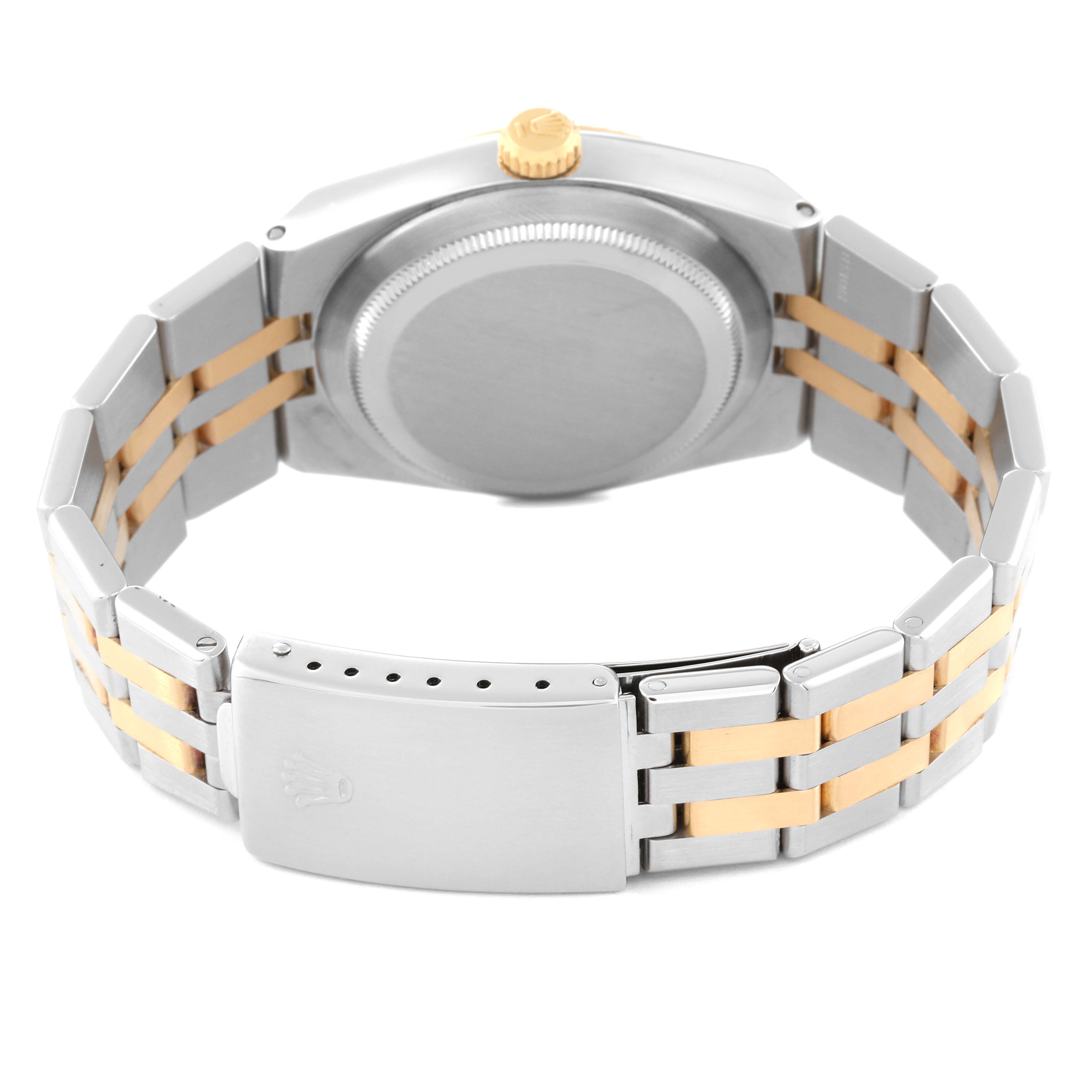 The image shows the back view of a Rolex Oysterquartz 17013 Men's Steel and Gold (two tone) Champagne Dial 17013 Men's Steel and Gold (two tone) Champagne Dial watch, highlighting its back case, crown, and two-tone bracelet with clasp.