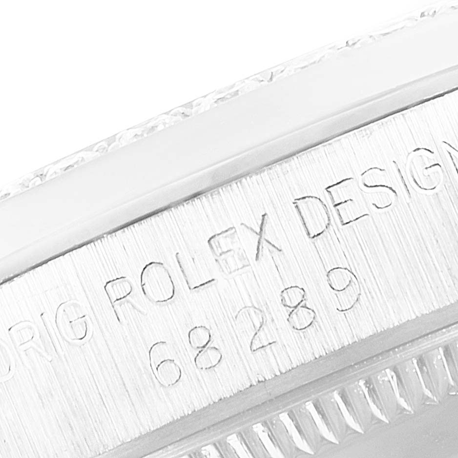 This image shows a close-up of the engraving on the side of a Rolex President 68289 Women's White Gold White Dial 68289 Women's White Gold White Dial model watch case.