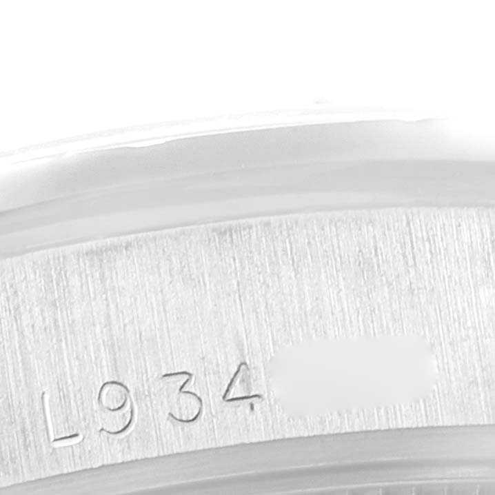 The image shows a close-up of the serial number engraving on the case of a Rolex President 68289 Women's White Gold White Dial 68289 Women's White Gold White Dial model watch.