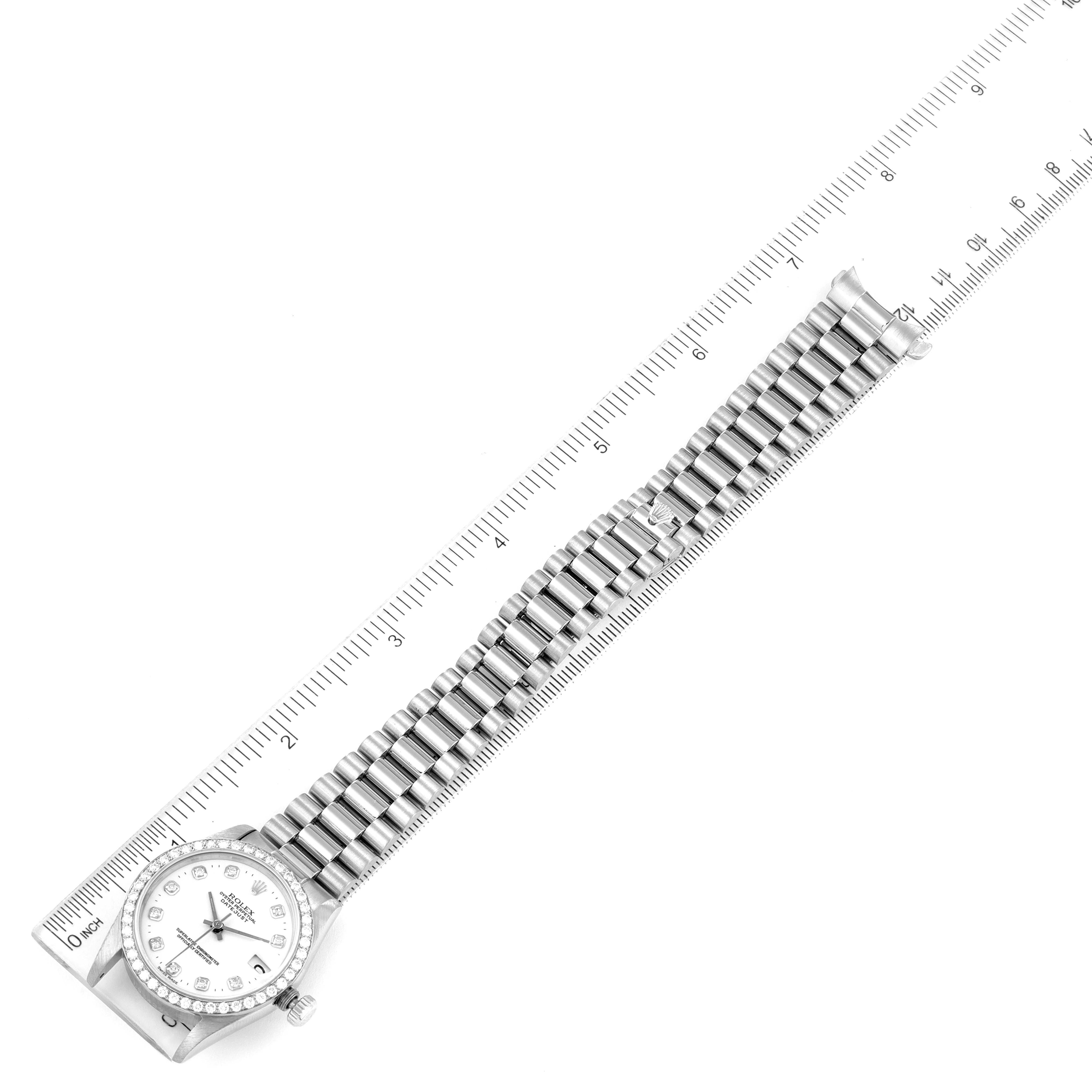 The image shows the Rolex President 68289 Women's White Gold White Dial 68289 Women's White Gold White Dial watch laid flat, displaying its face, bezel, and full bracelet alongside a ruler.