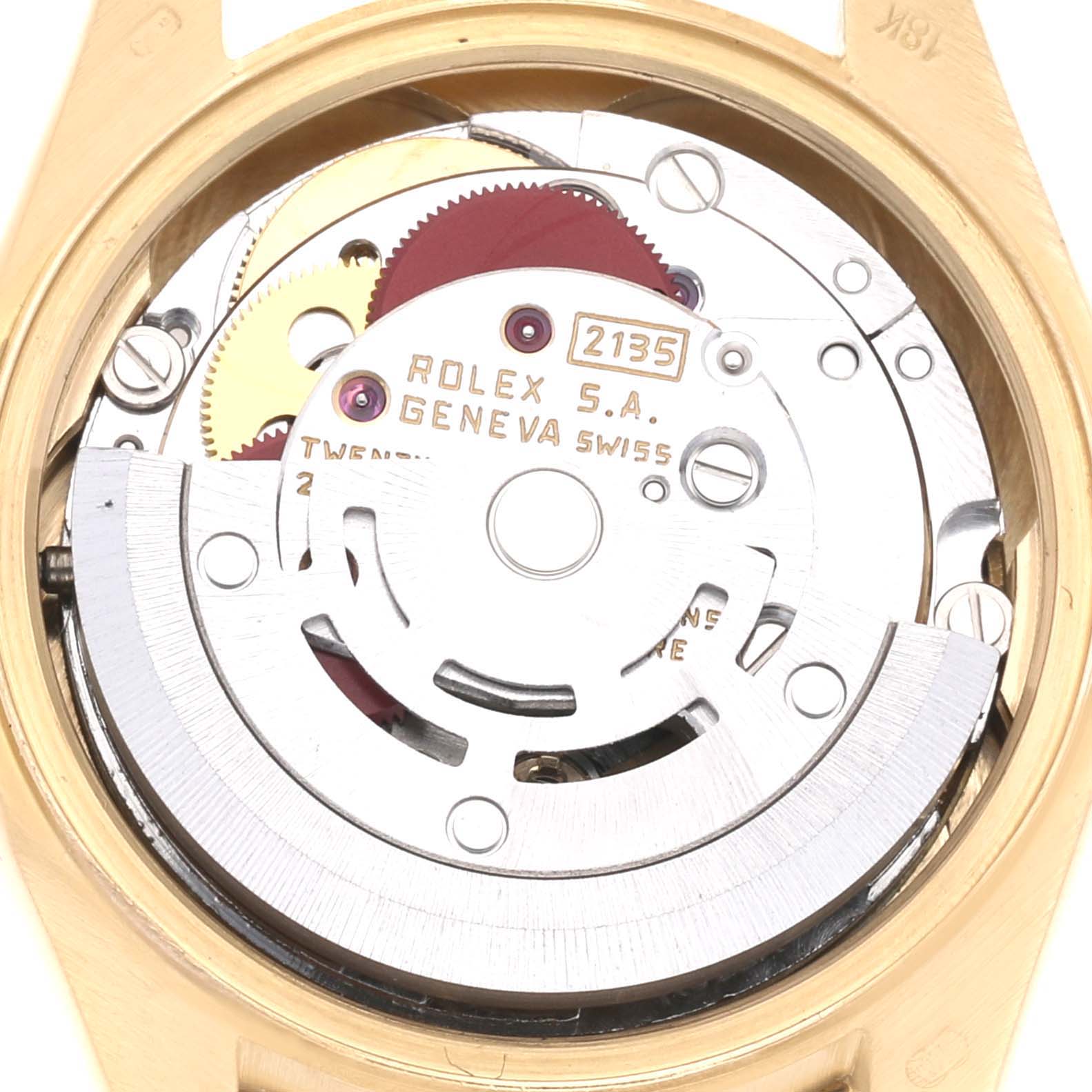 This close-up image shows the inner mechanical movement of a Rolex President 69158 Women
s Yellow Gold Champagne Dial 69158 Women
s Yellow Gold Champagne Dial model, highlighting the gears and rotor.