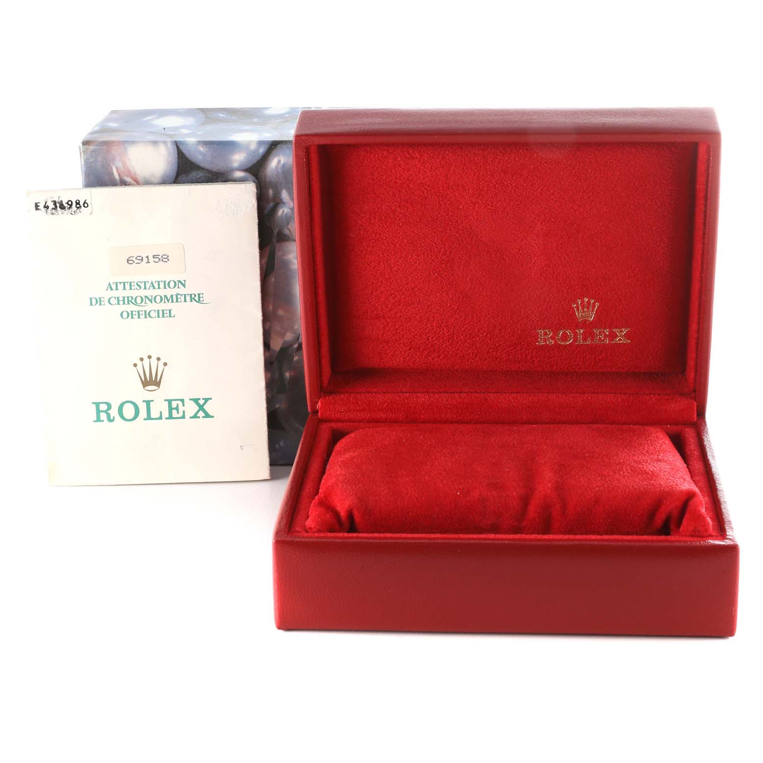 The image shows a red Rolex watch box for the President model and a certification booklet.